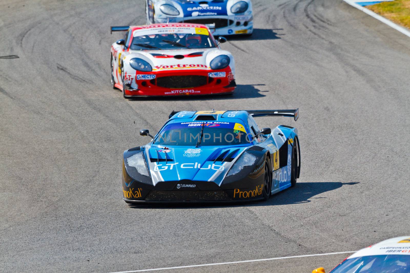 JEREZ DE LA FRONTERA, SPAIN - OCT 16: Ferran Monje(4) followed by Francesc Gutierrez(42) and Pedro Lopes(44) races on Iber GT championship on October 16 , 2011, in Jerez de la Frontera , Spain