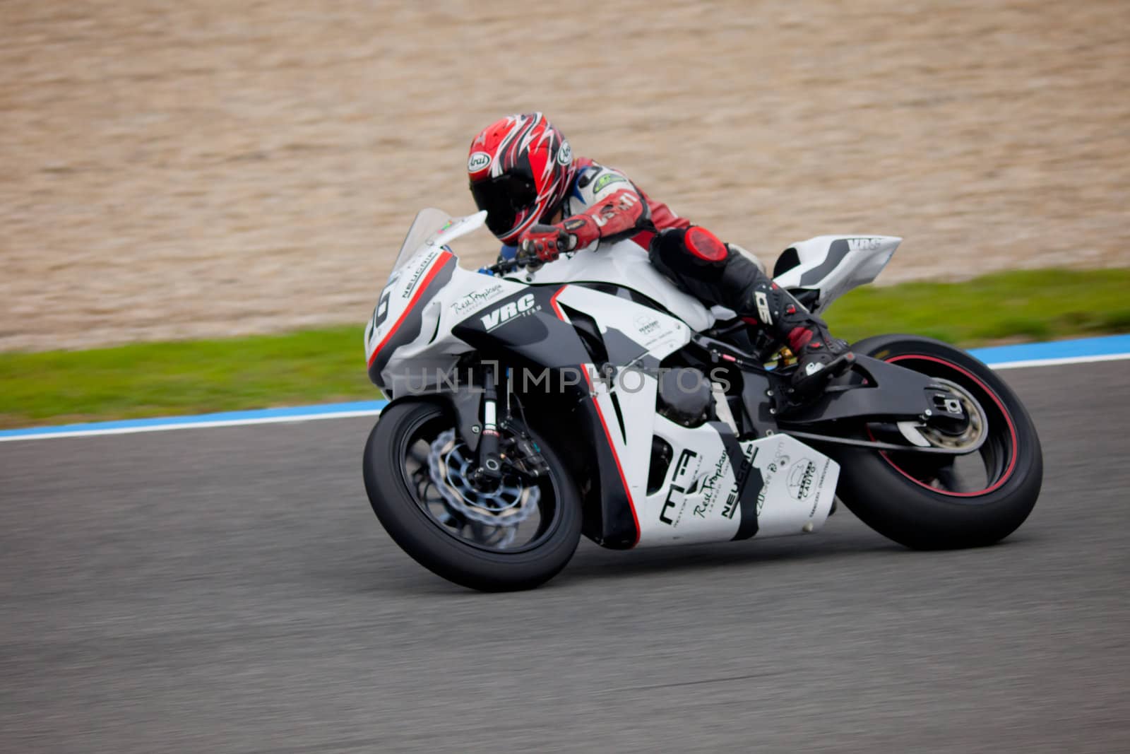 JEREZ DE LA FRONTERA, SPAIN - NOV 20: Stock Extreme motorcyclist Adrian Gandara takes a curve in the CEV championship on Nov 20, 2010, in Jerez de la Frontera, Spain