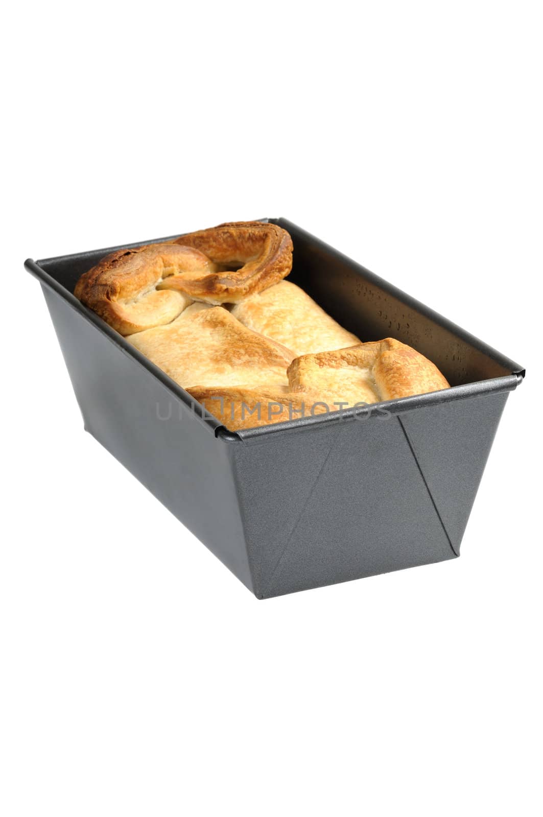 Bakery of puff pastry in the metallic form. Isolated on white background.