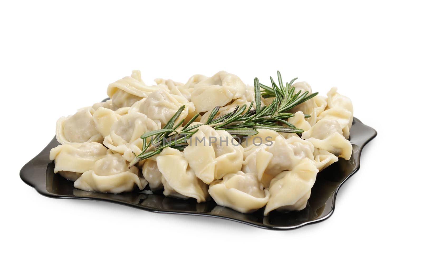 Ready to eat ravioli on a plate. Decorated with rosemary. Isolated on white.