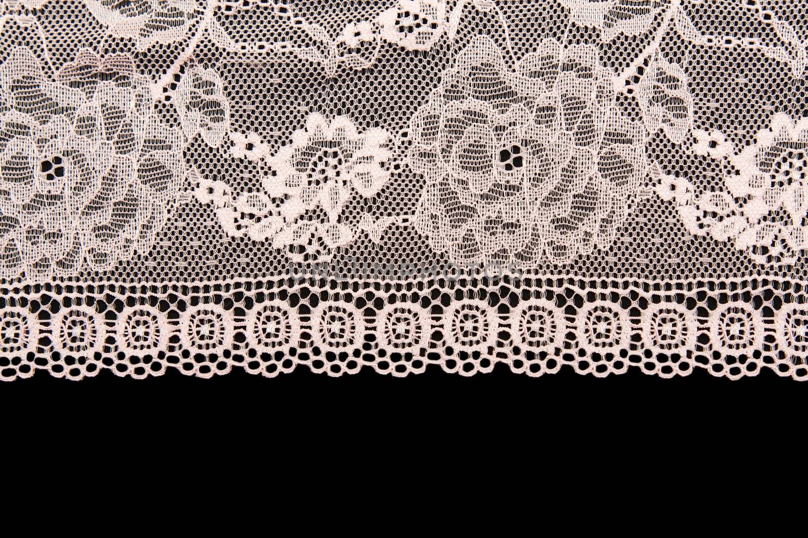 Pink lace with a floral pattern on a black background