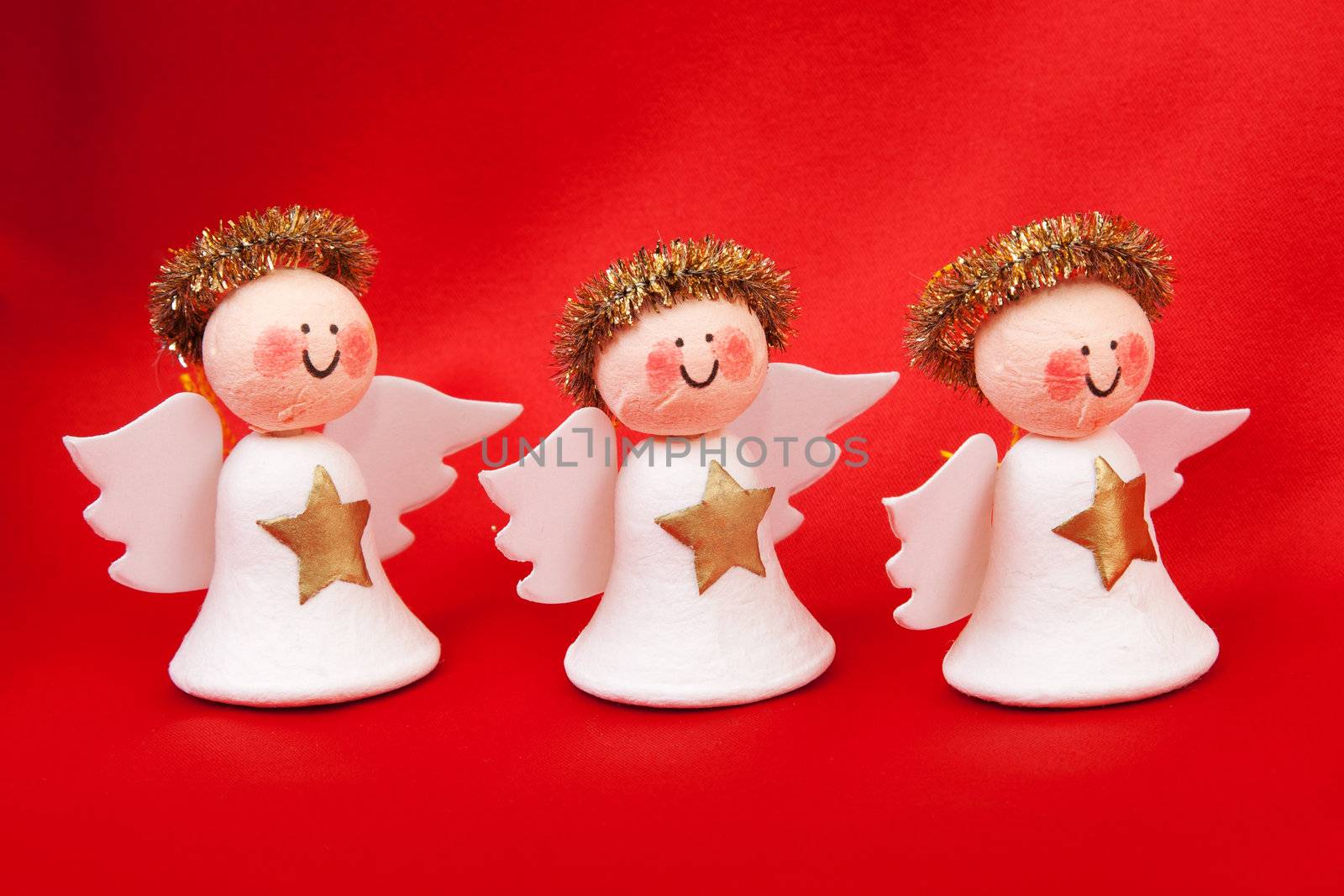 Decorative angel from a set scrapbooking on a red background
