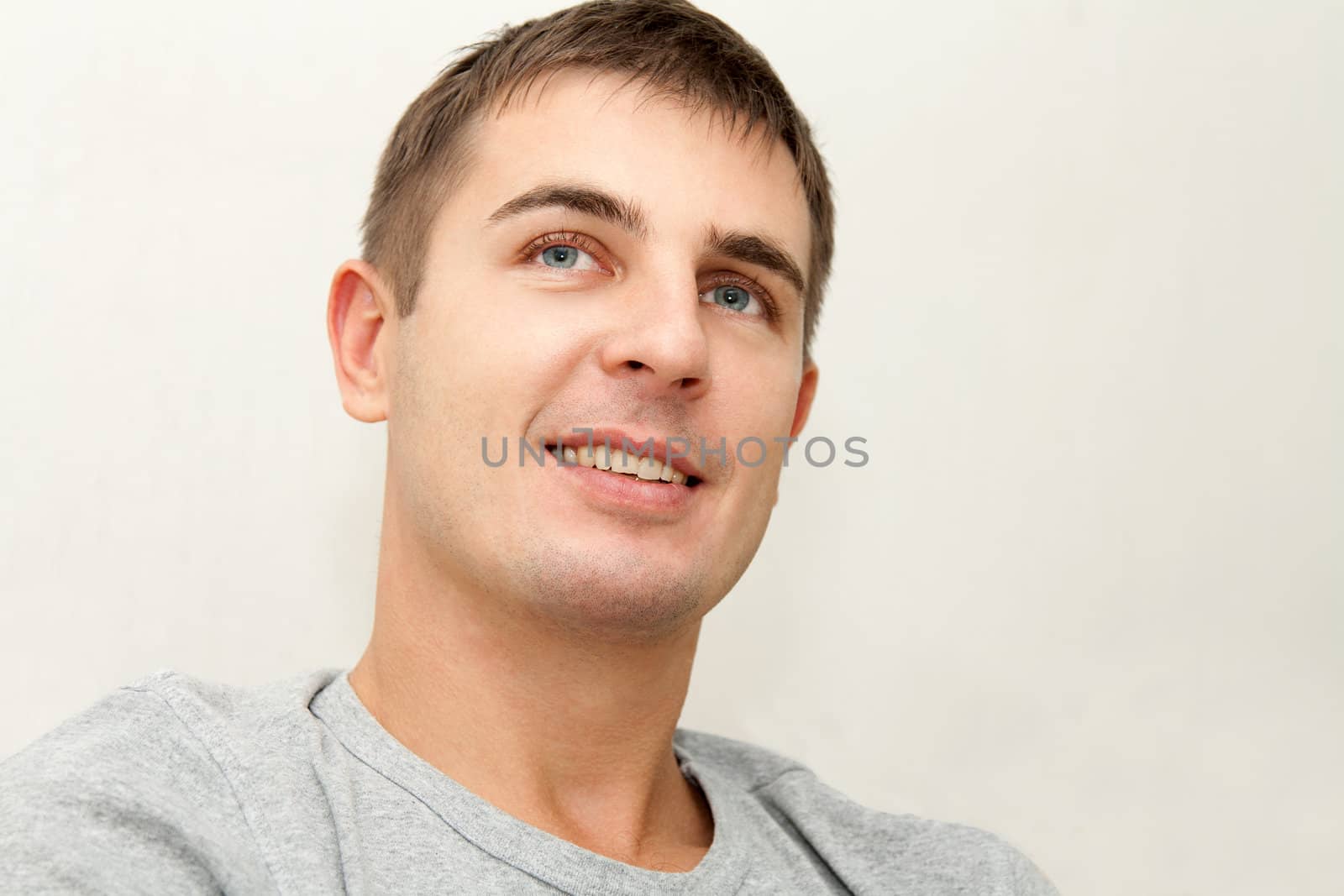 Portrait of a young handsome man on white background