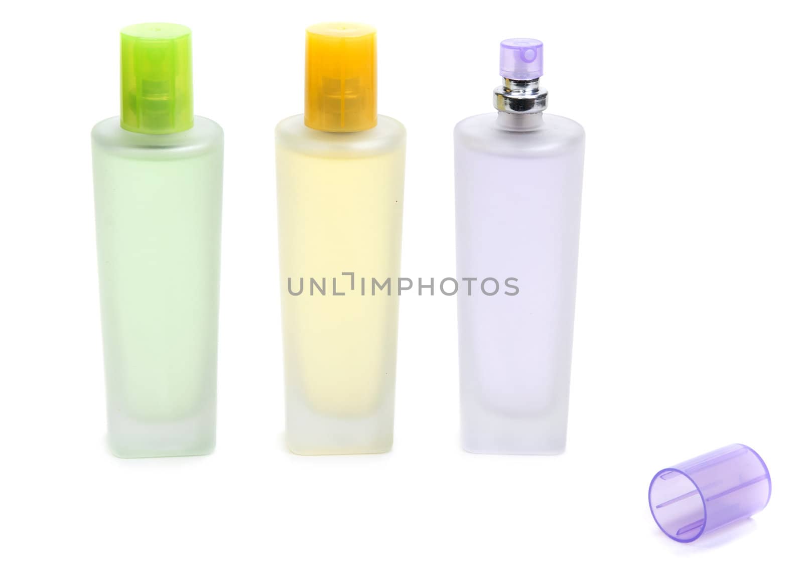 Three perfume bottle isolated on white background