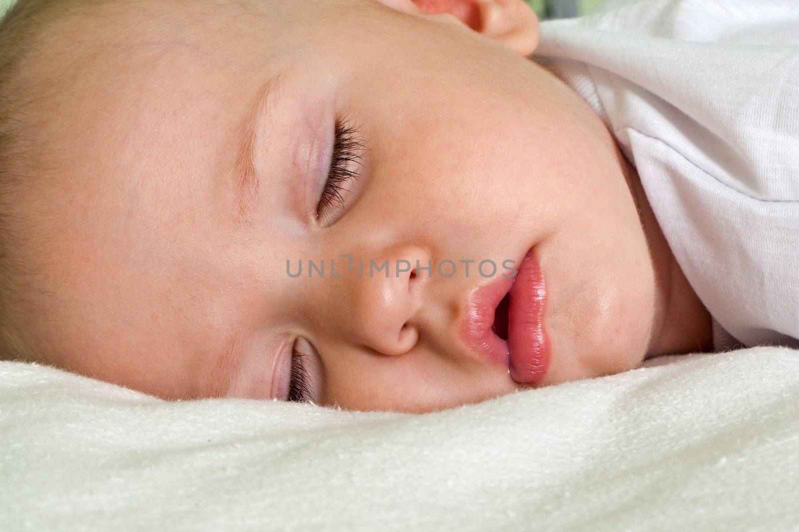 Little child sleeping and smiling