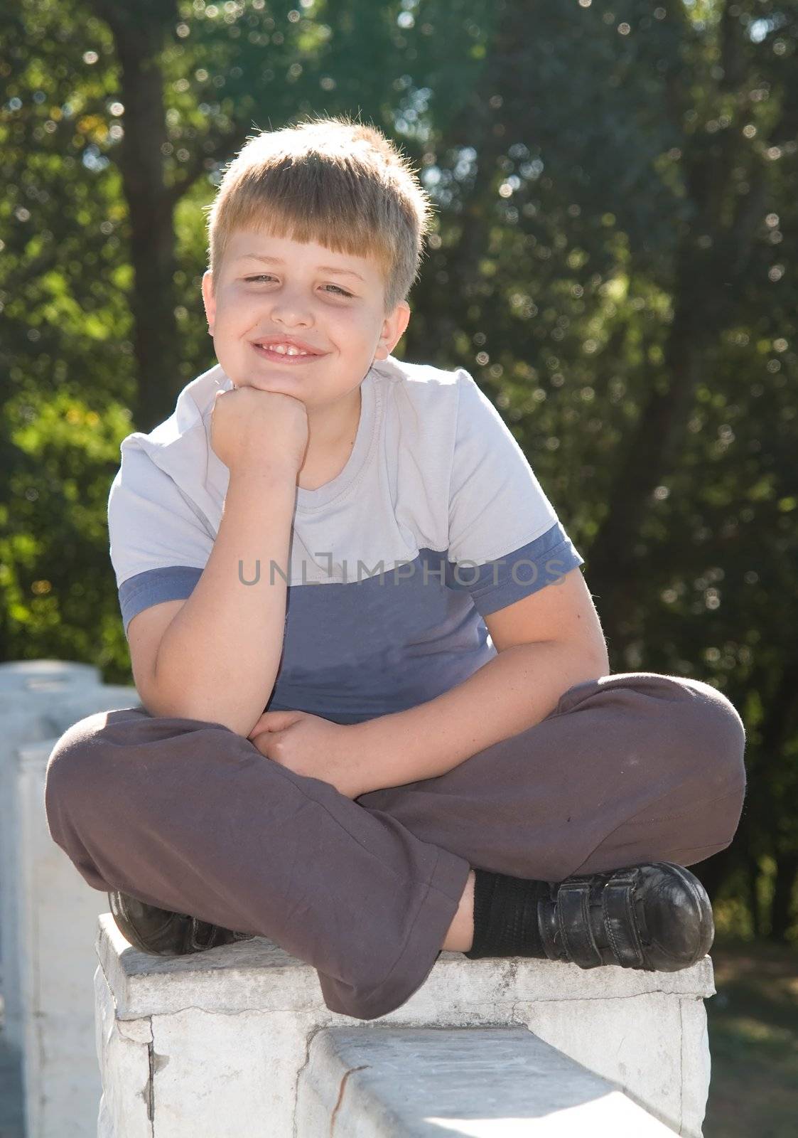 Portrait of a boy with a pleased smile upon one's face
