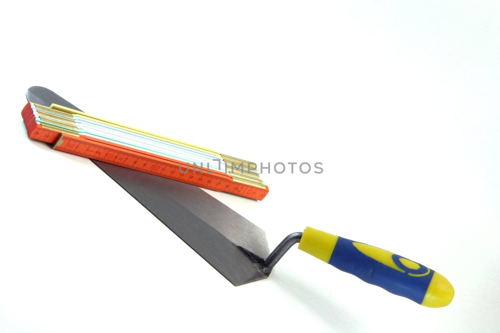 construction tools trowel and meter isolated in white background