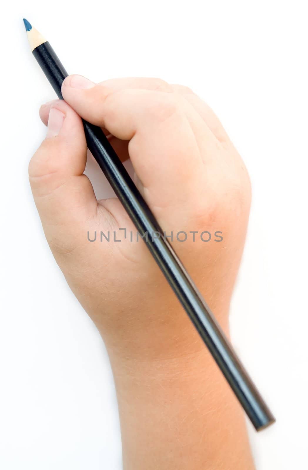 Children's hand with a pencil on a white background