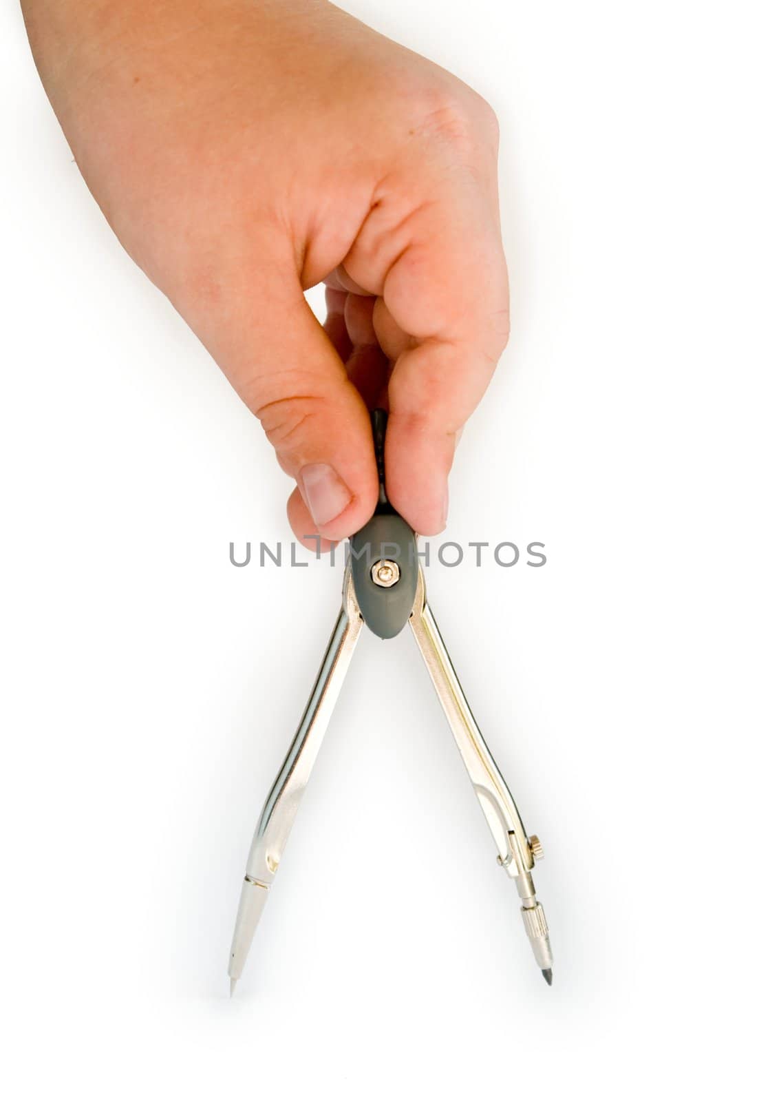 Children's hand with a metal compasses on a white background