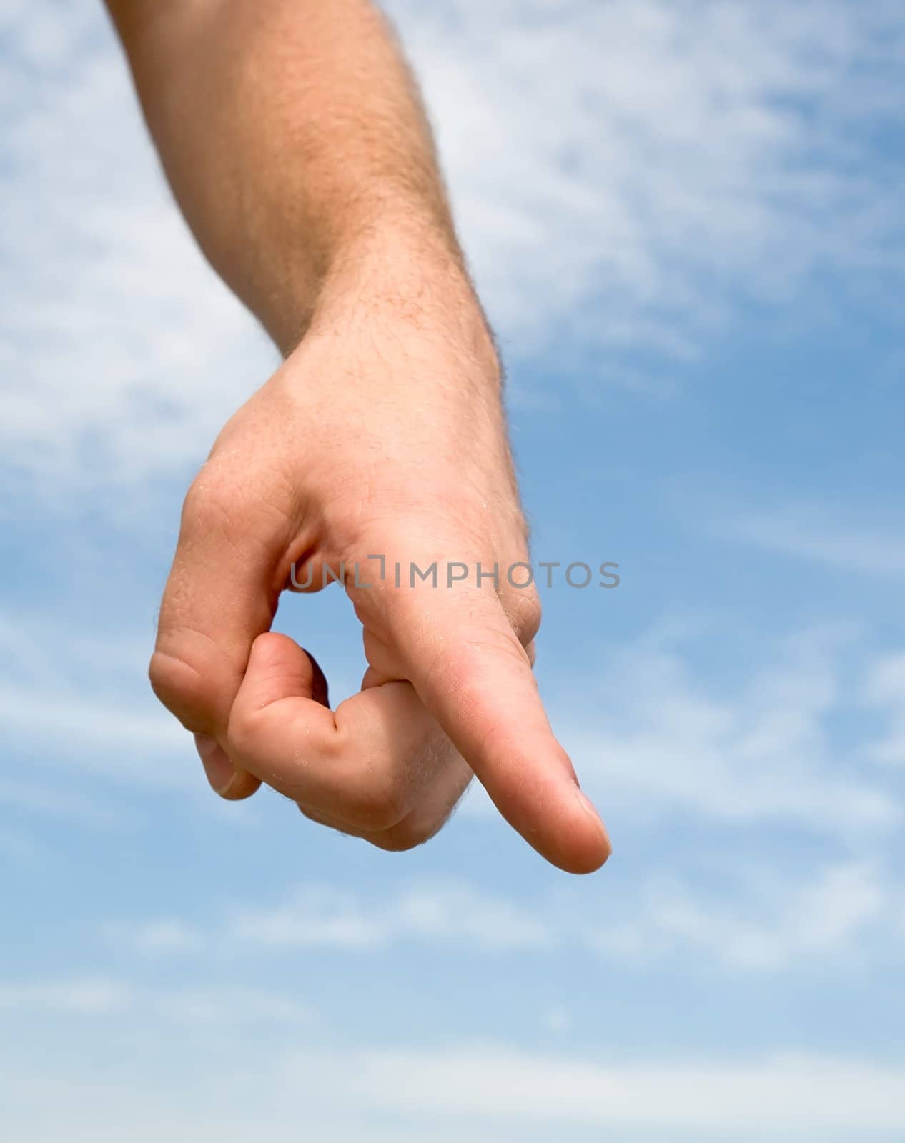 finger. Human hand on a blue sky