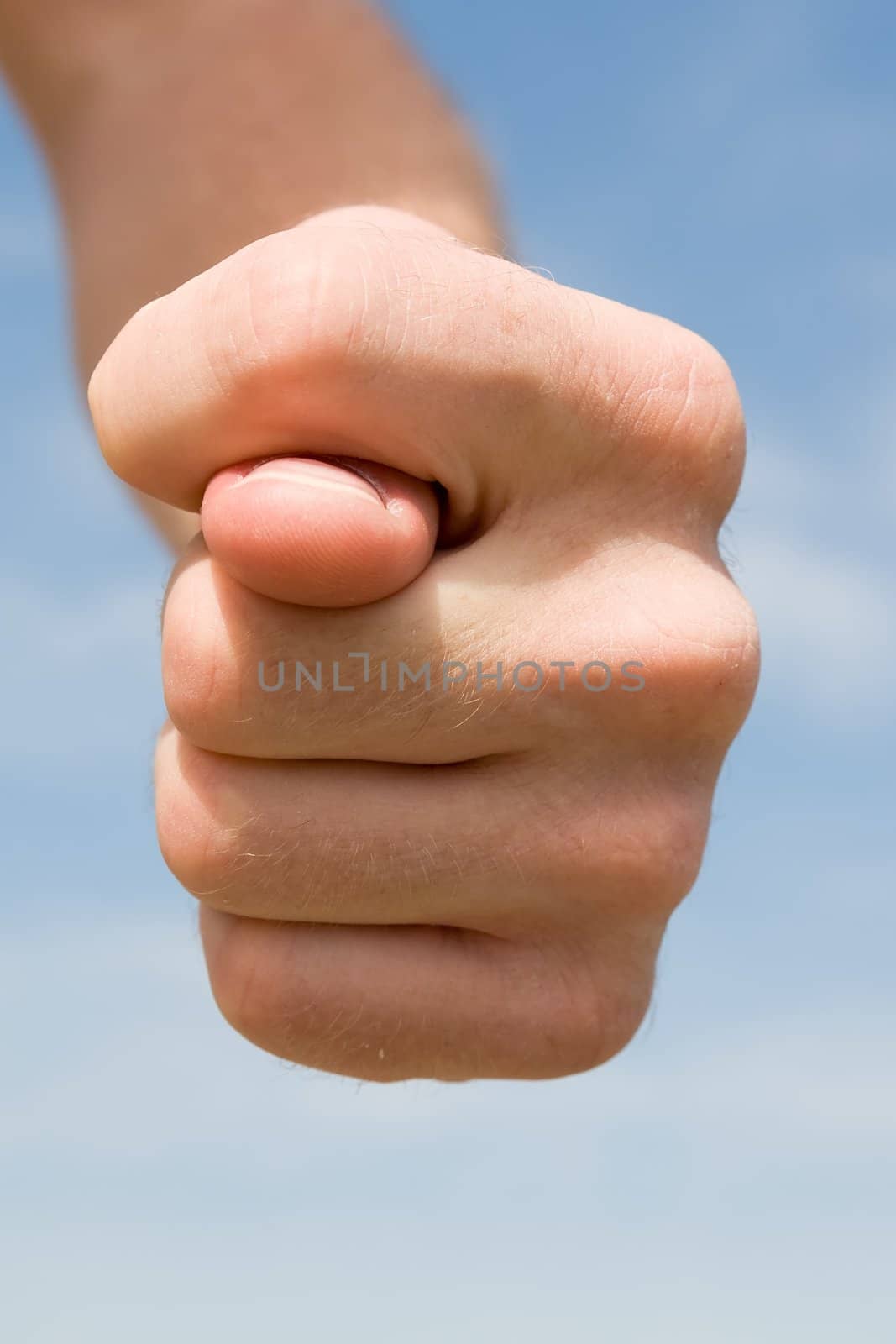 fig. Human hand on a blue sky