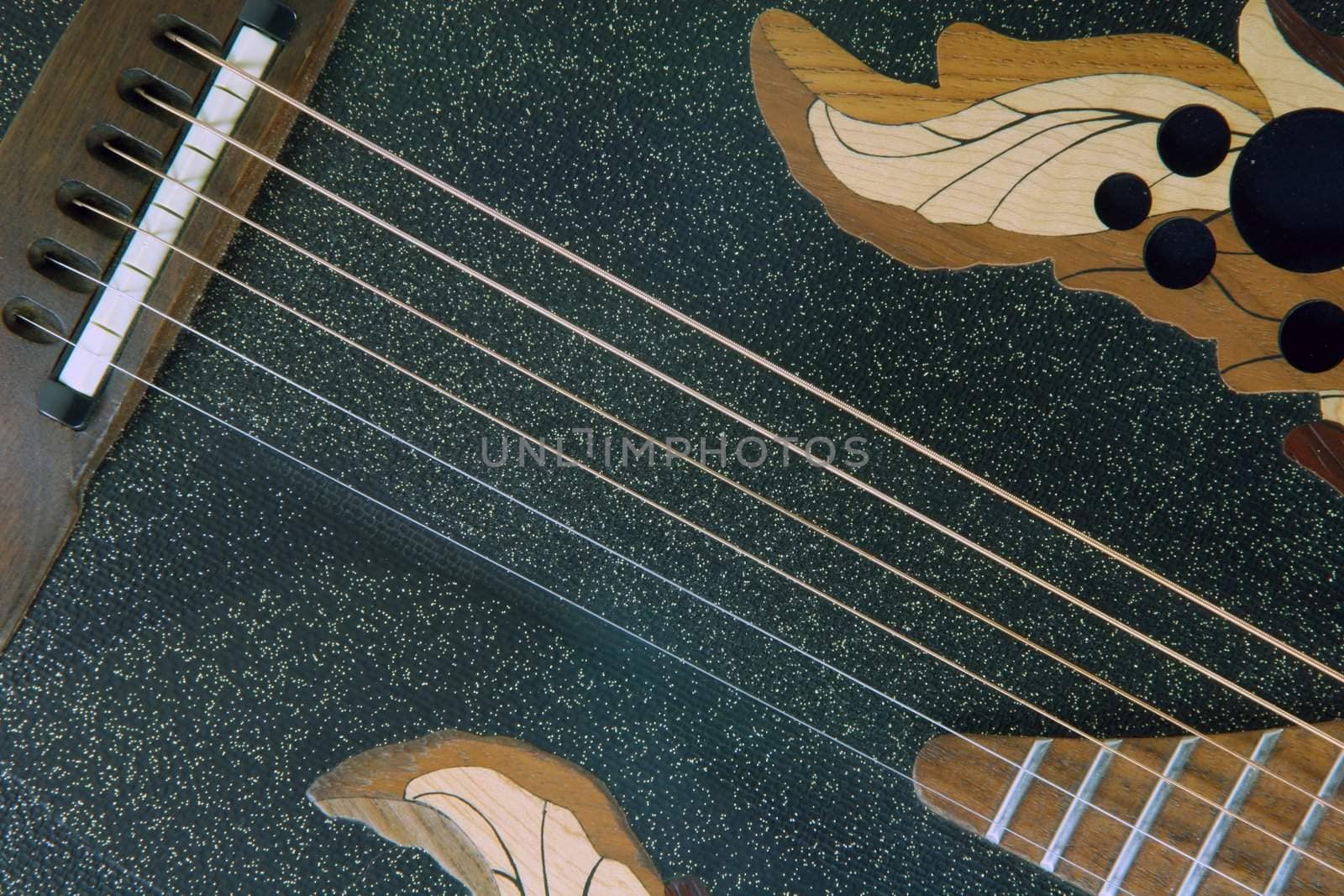 black guitar and strings detail music equipment