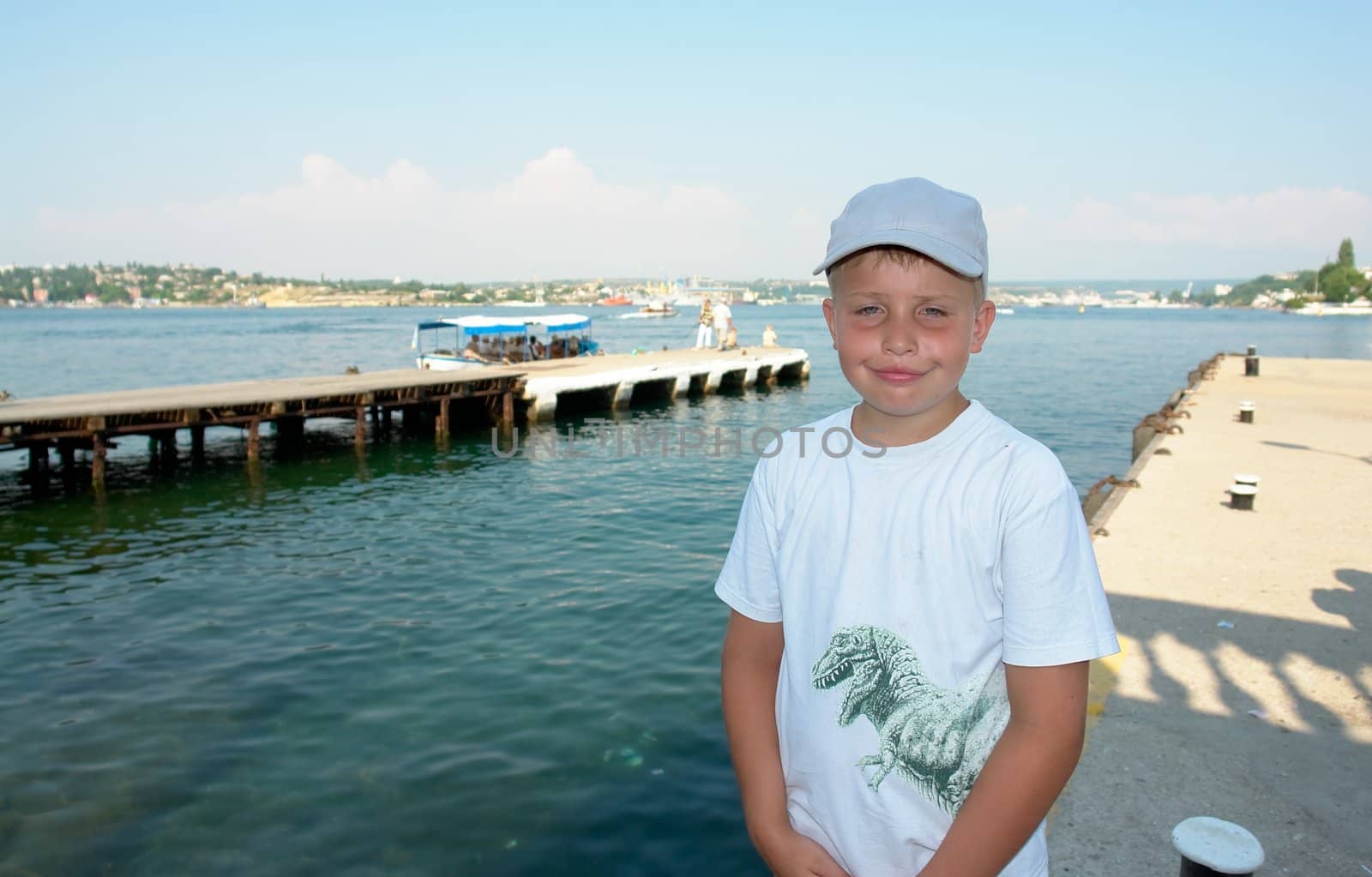 Portrait of a boy with a pleased smile upon one's face