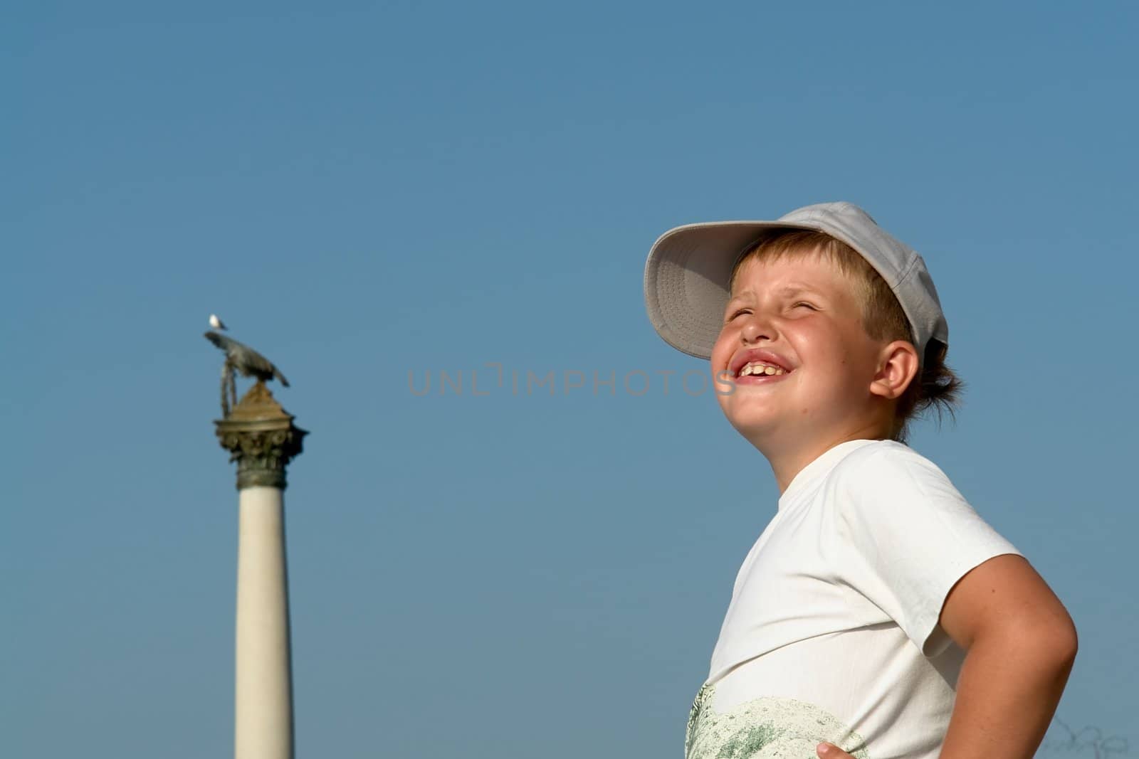Portrait of a boy with a pleased smile upon one's face