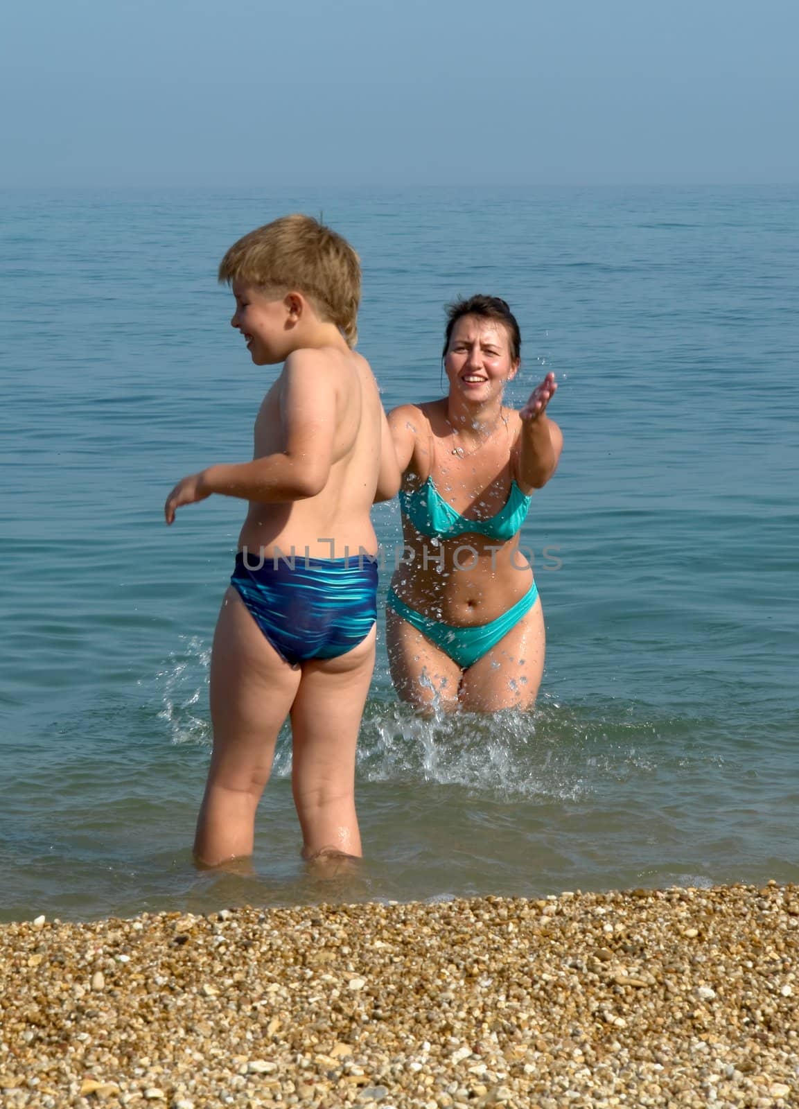 Mum and the son on the beach