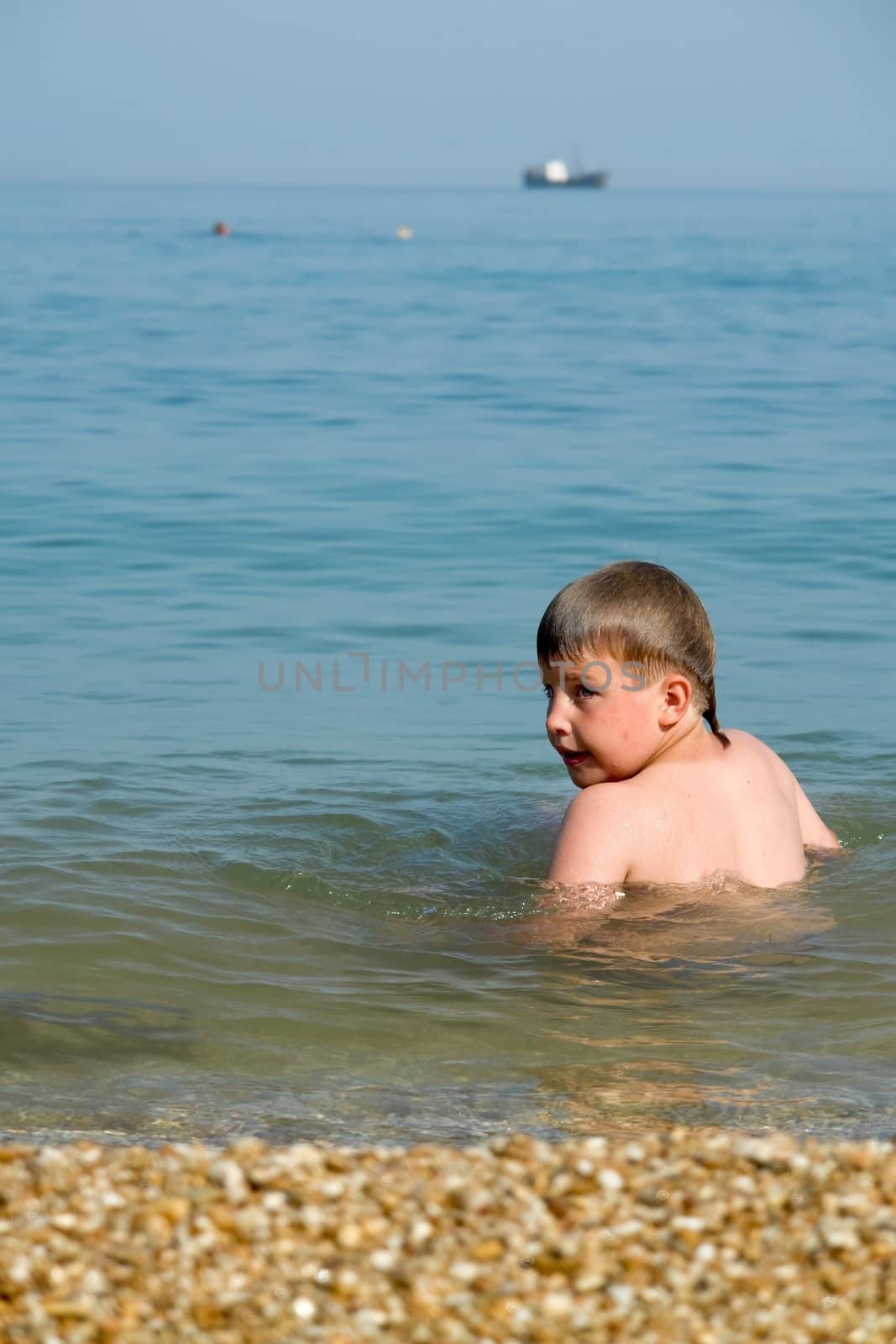 summer days. little boy on the beach