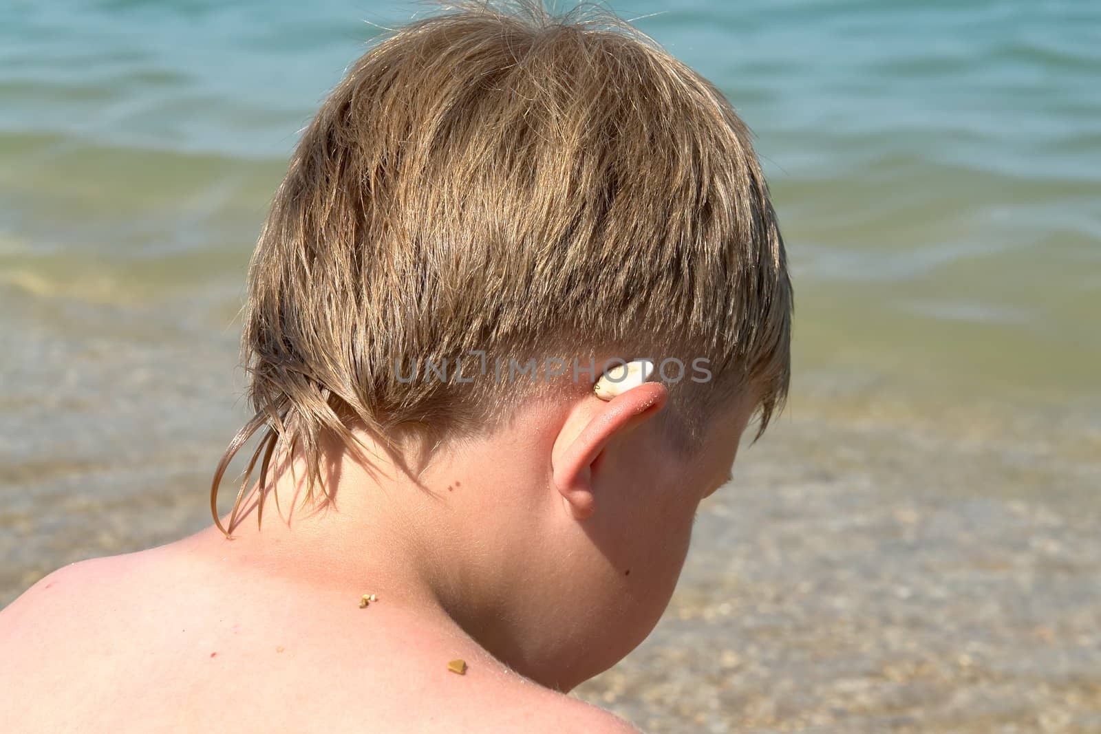 summer days. little boy on the beach