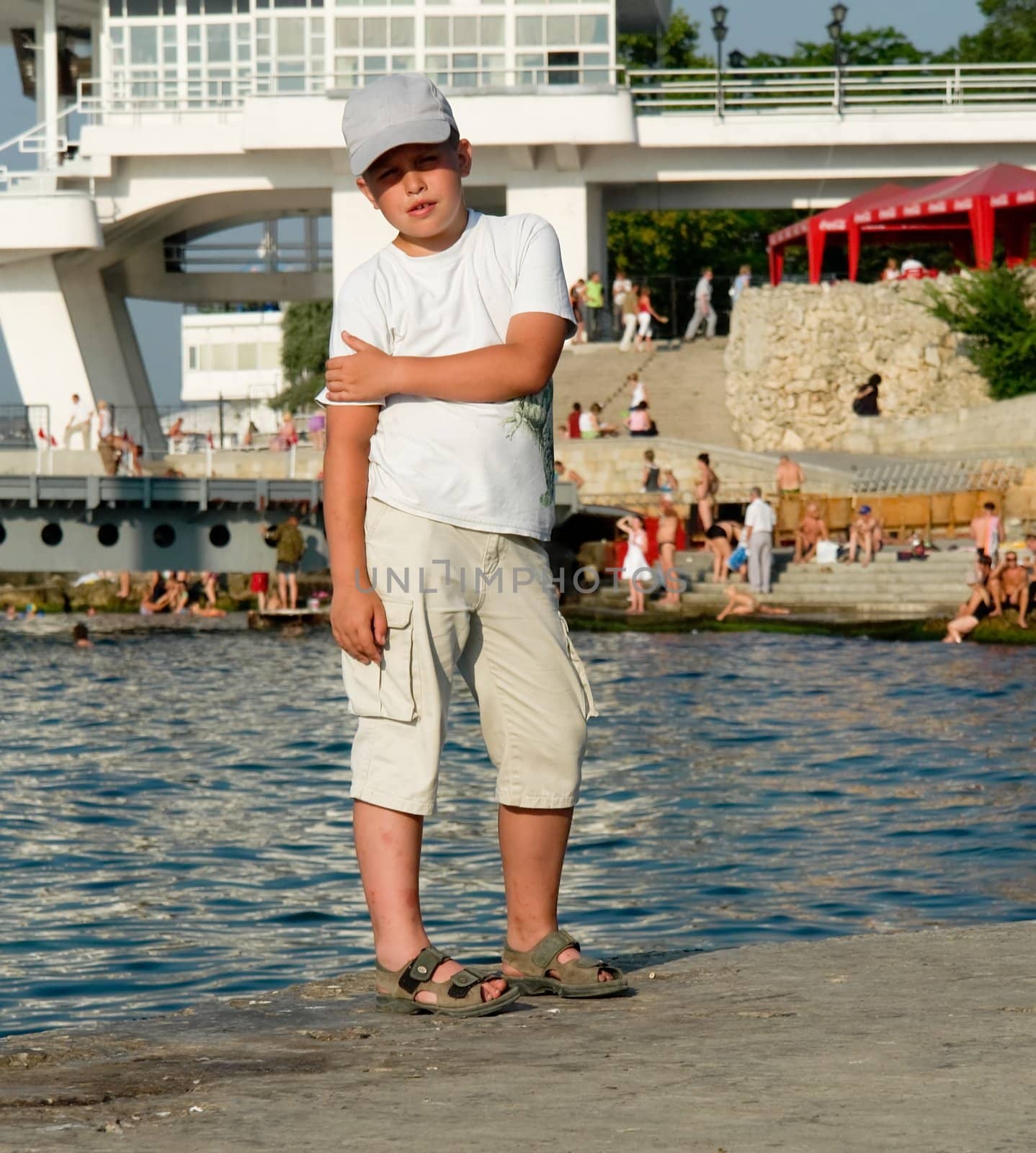 Portrait of a boy in front of water