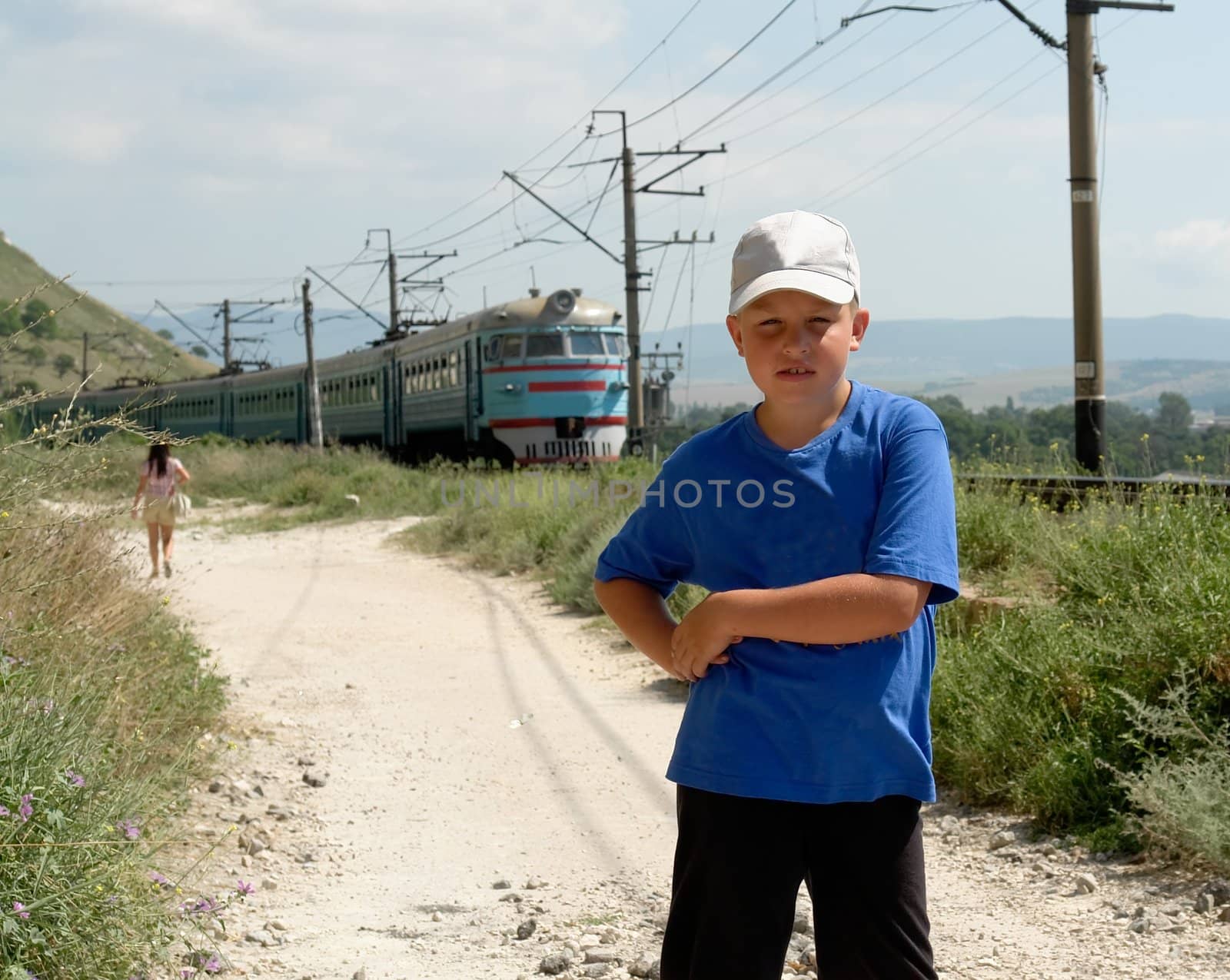 The little boy against a rushing train