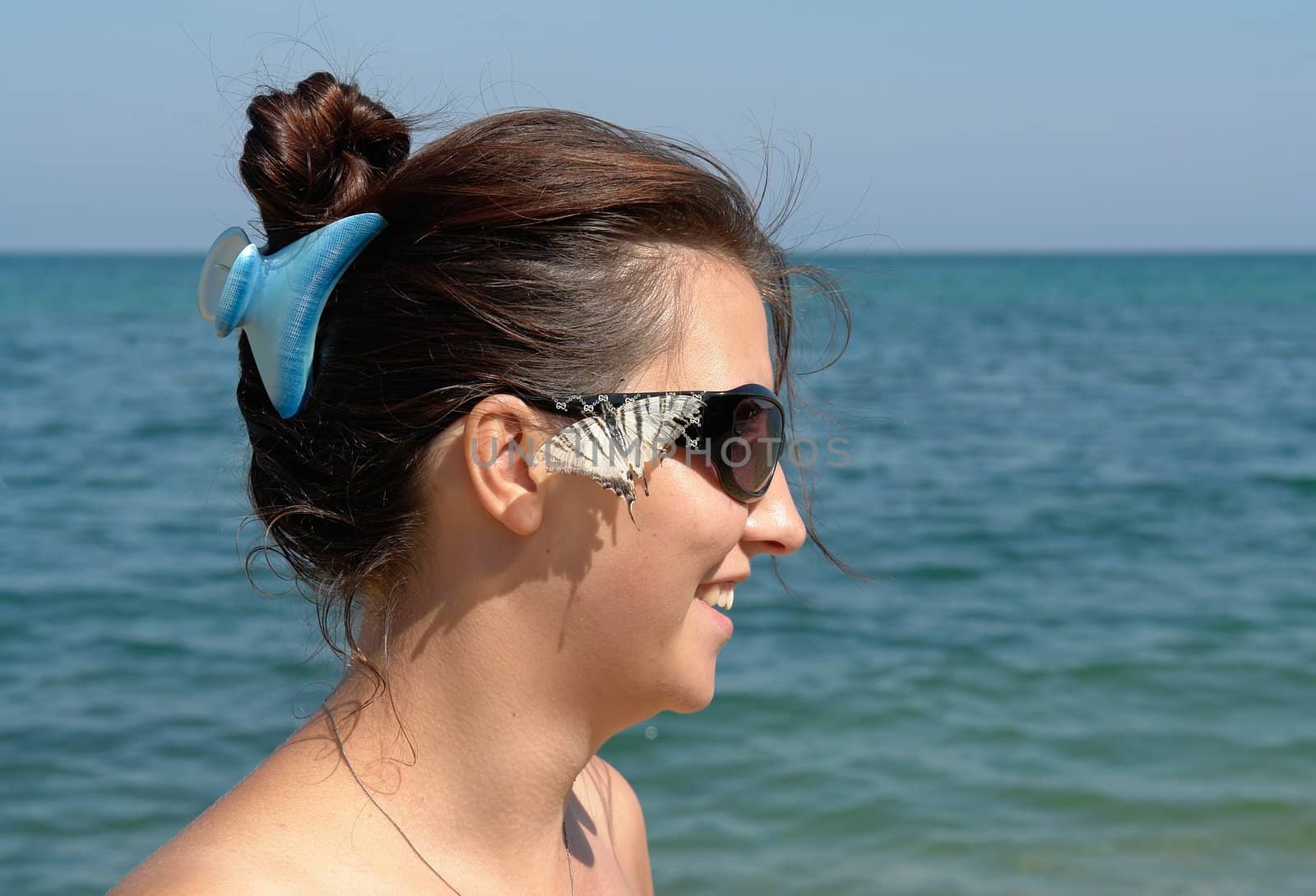 Summer Days. Beautiful Young Woman on the Beach.