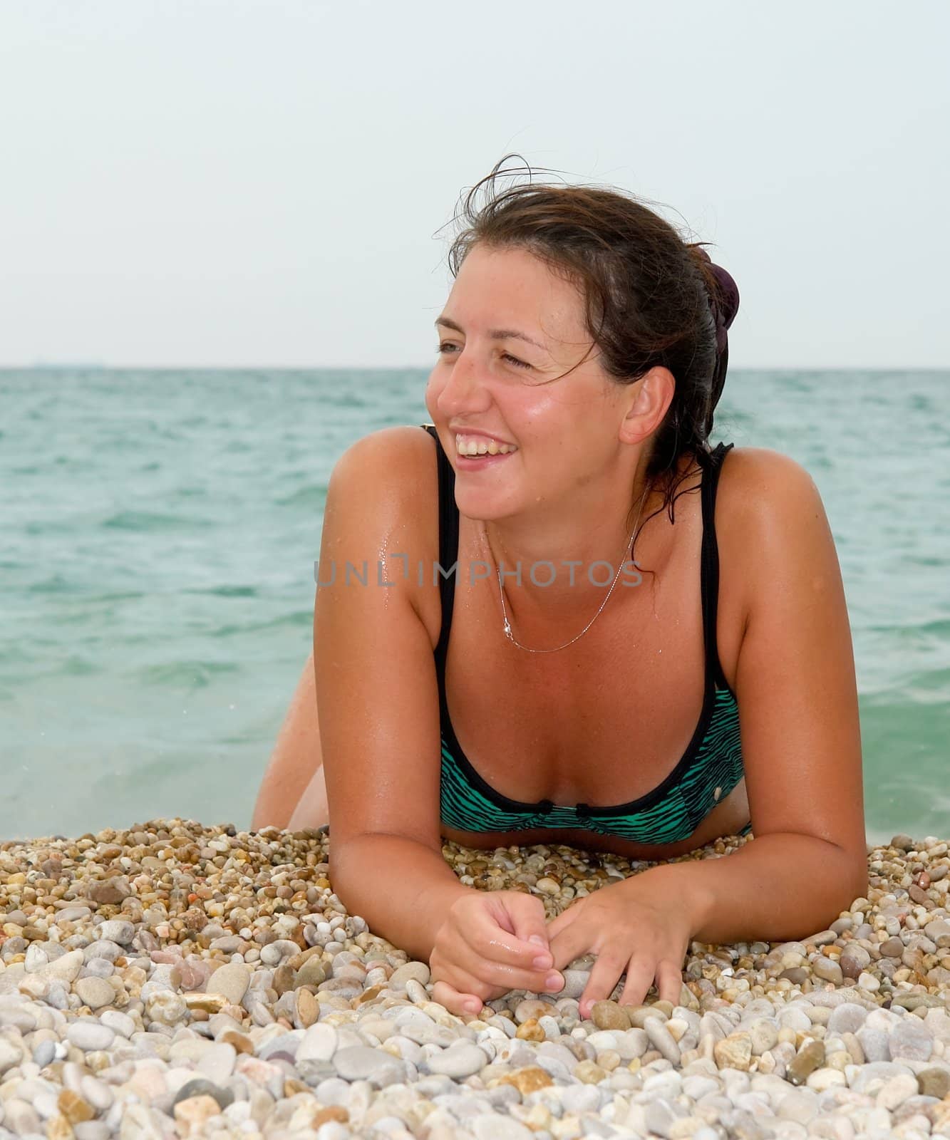 Portrait of the young woman against the sea