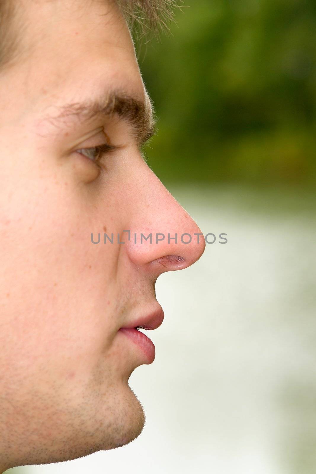 Man's portrait in a profile against the river