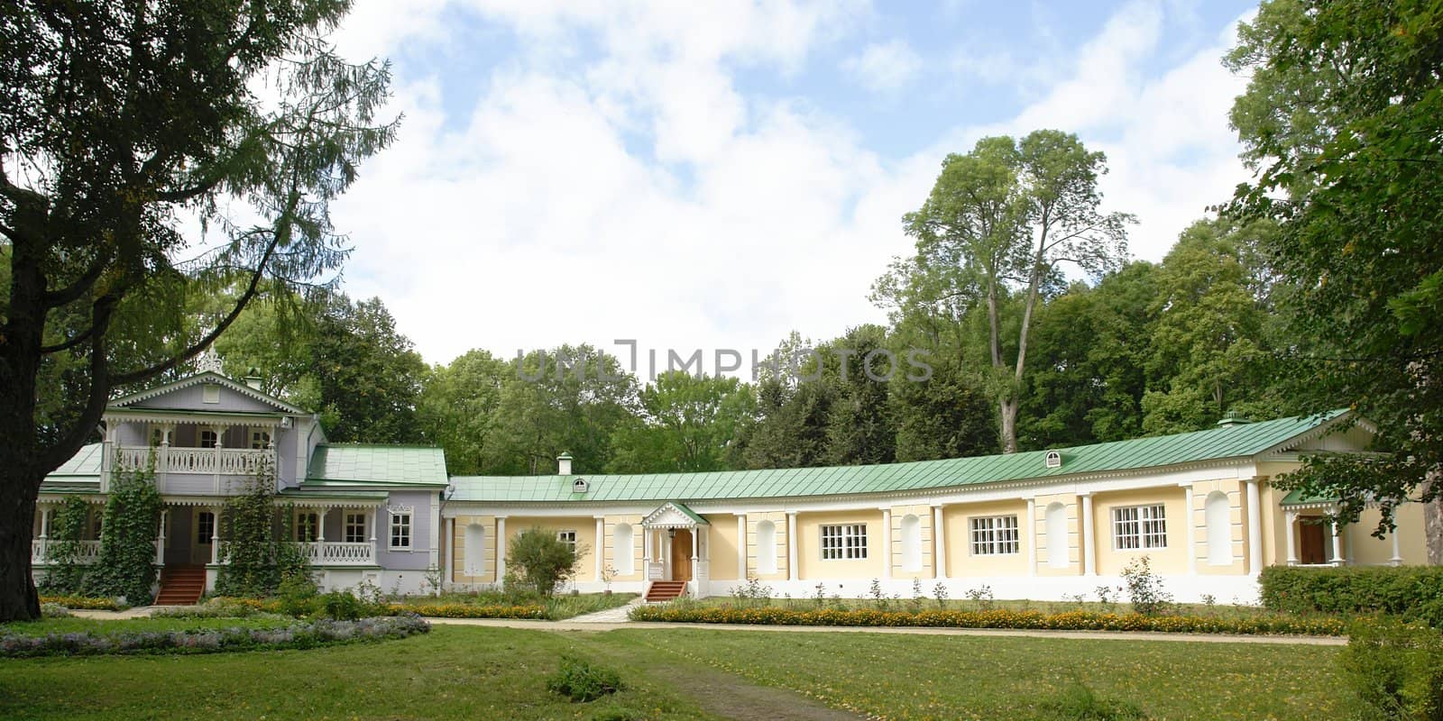 Rural landscape. The beautiful house on a green meadow.