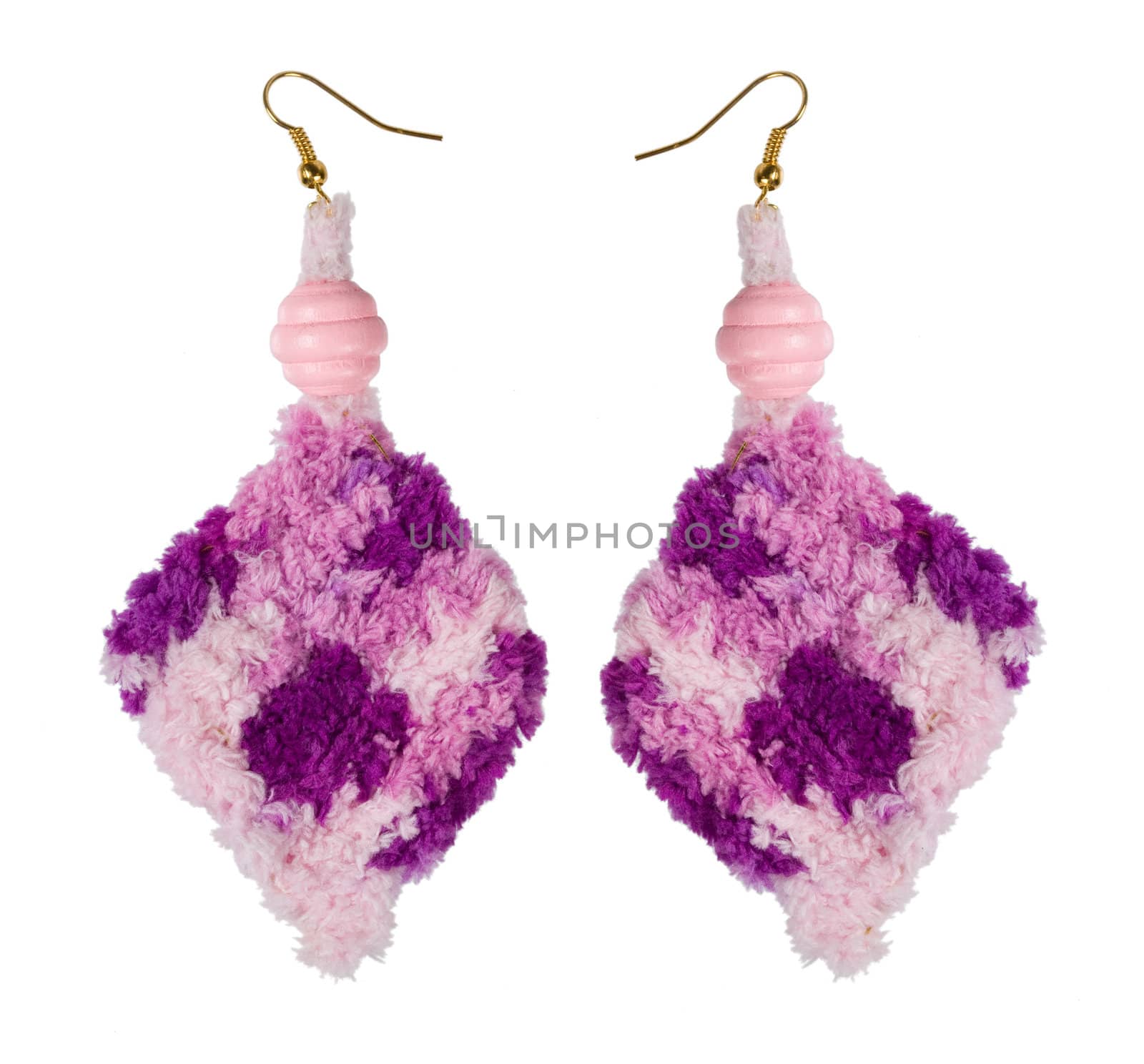 Crocheted earrings on a white background. Handmade. �ollage