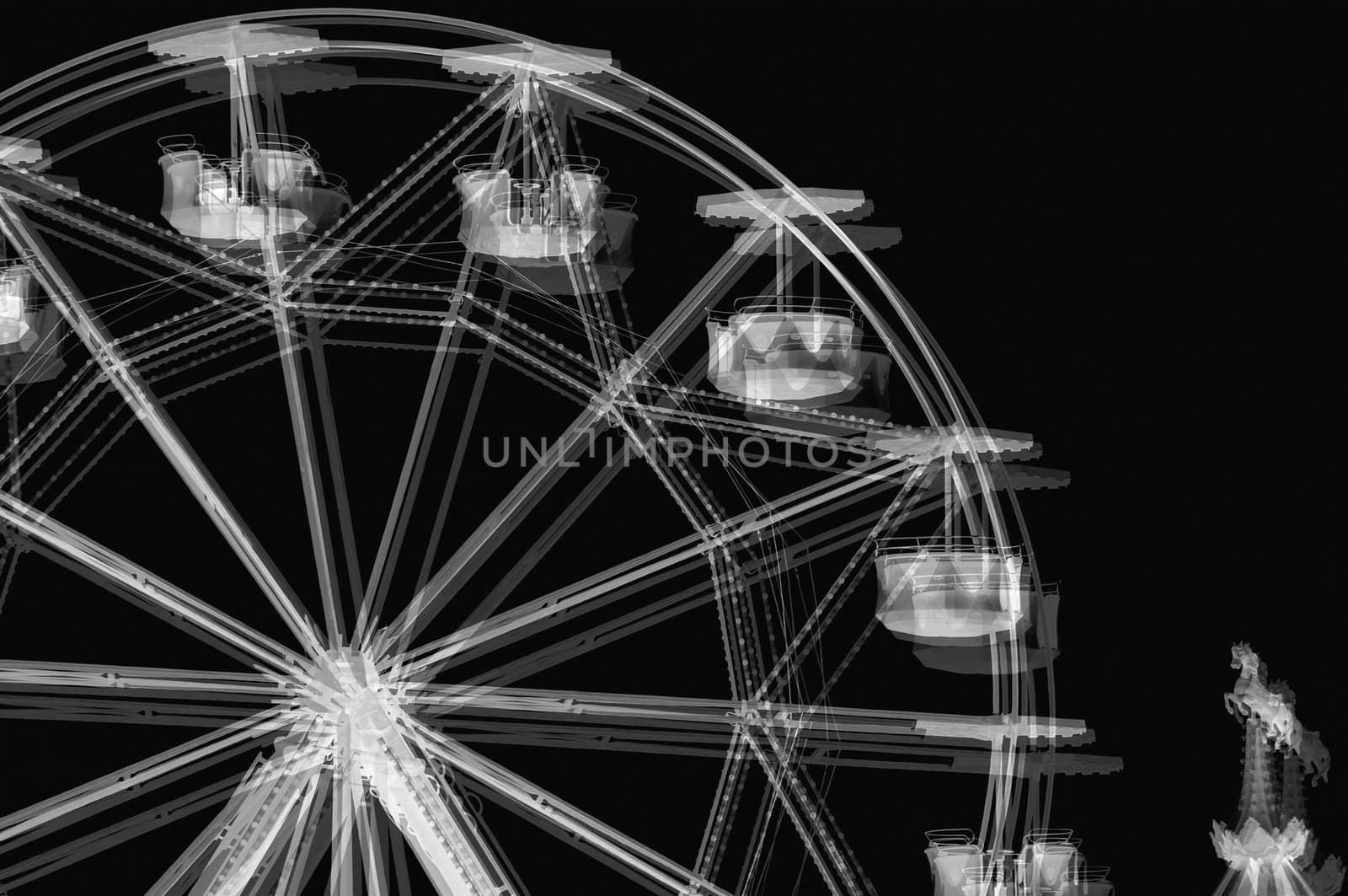 Ferris wheel carousel horse in amusement park. Black and white solarisation effect.