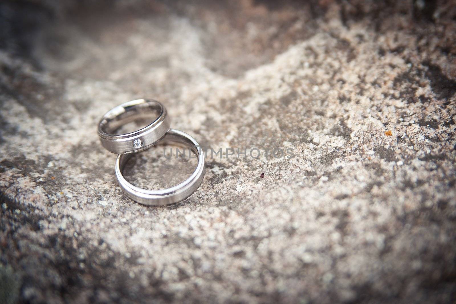 Pair of wedding rings on a stone