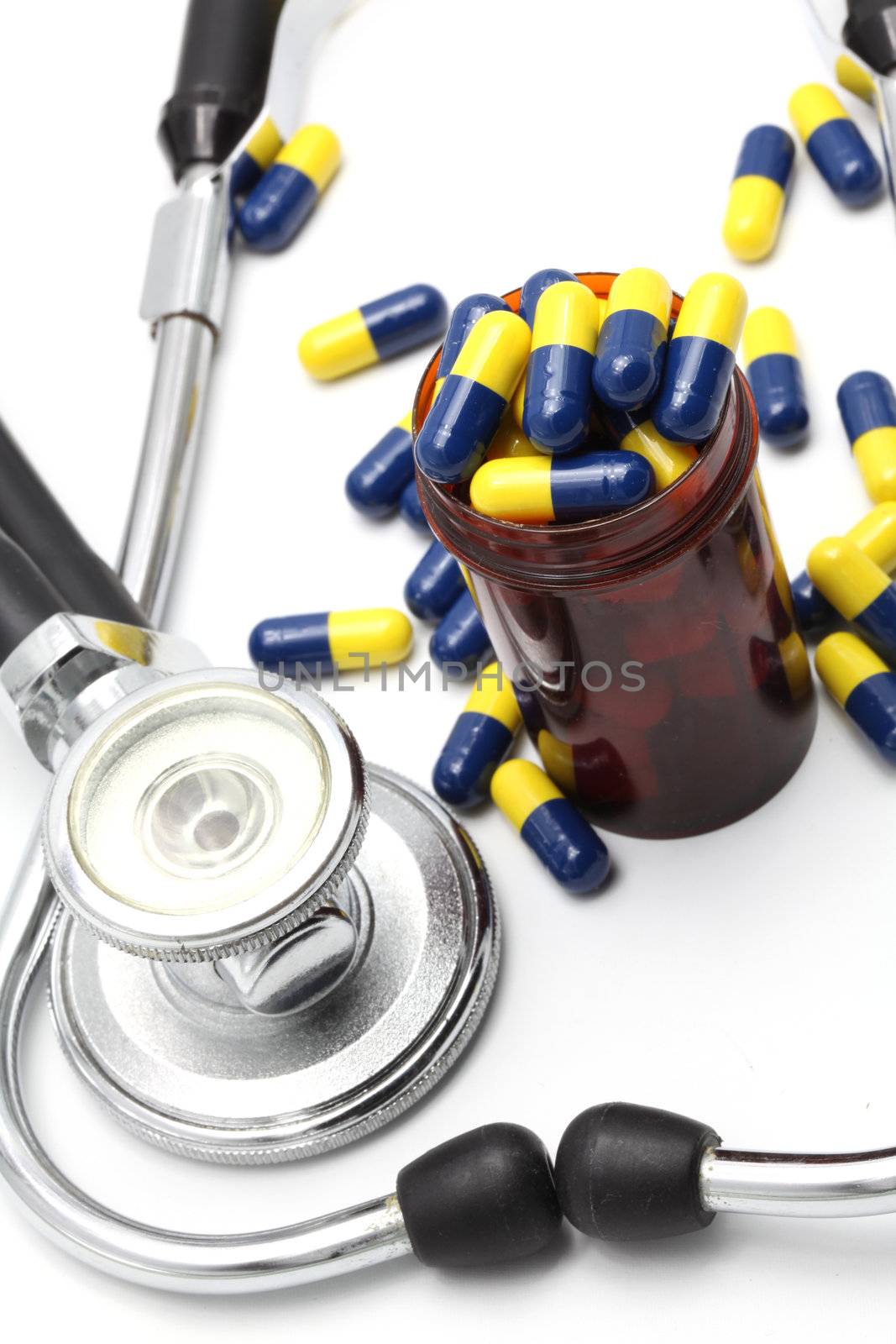 Perspective of Medical Stethoscope and Capsule on white background for Healthy Concept 