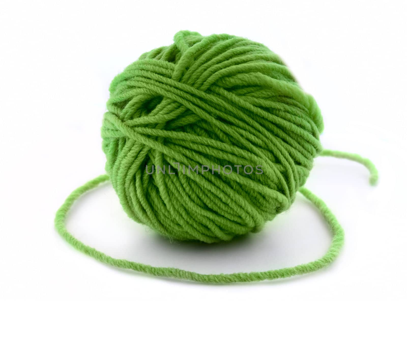 Green thread ball isolated on white background