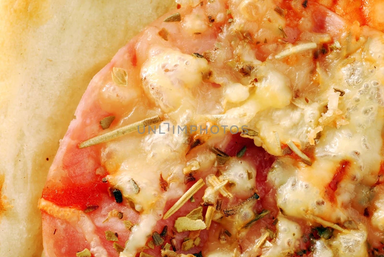piece of pizza with various ingredients macro background