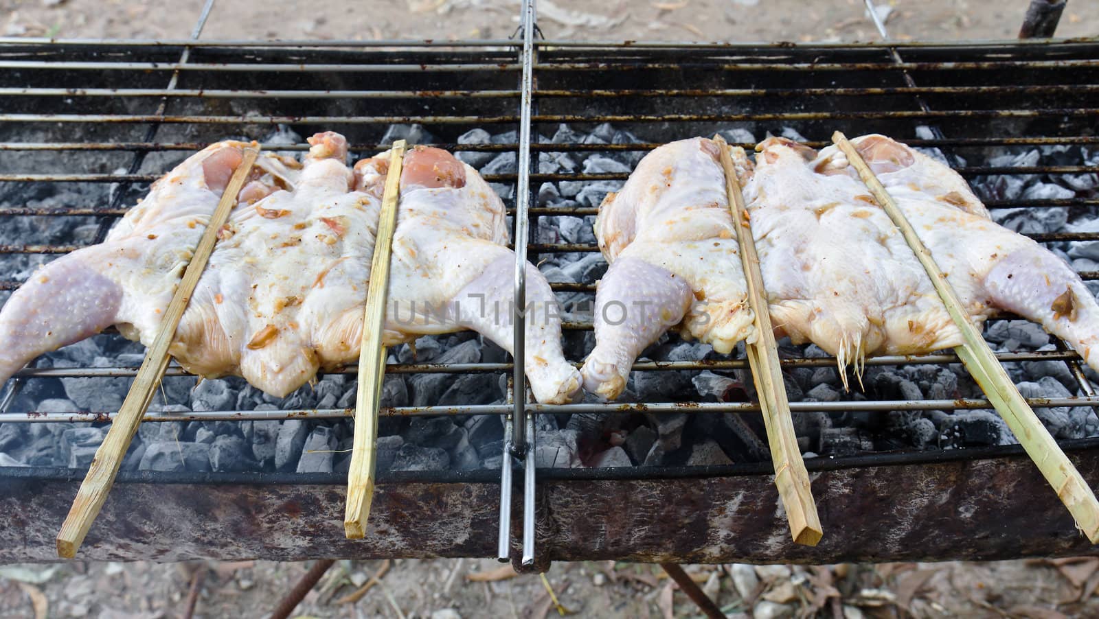 Roasting chicken on the chargrill