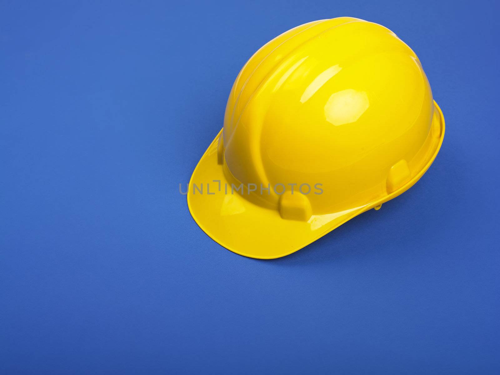 Yellow Hardhat hard hat Helmet on Blue
