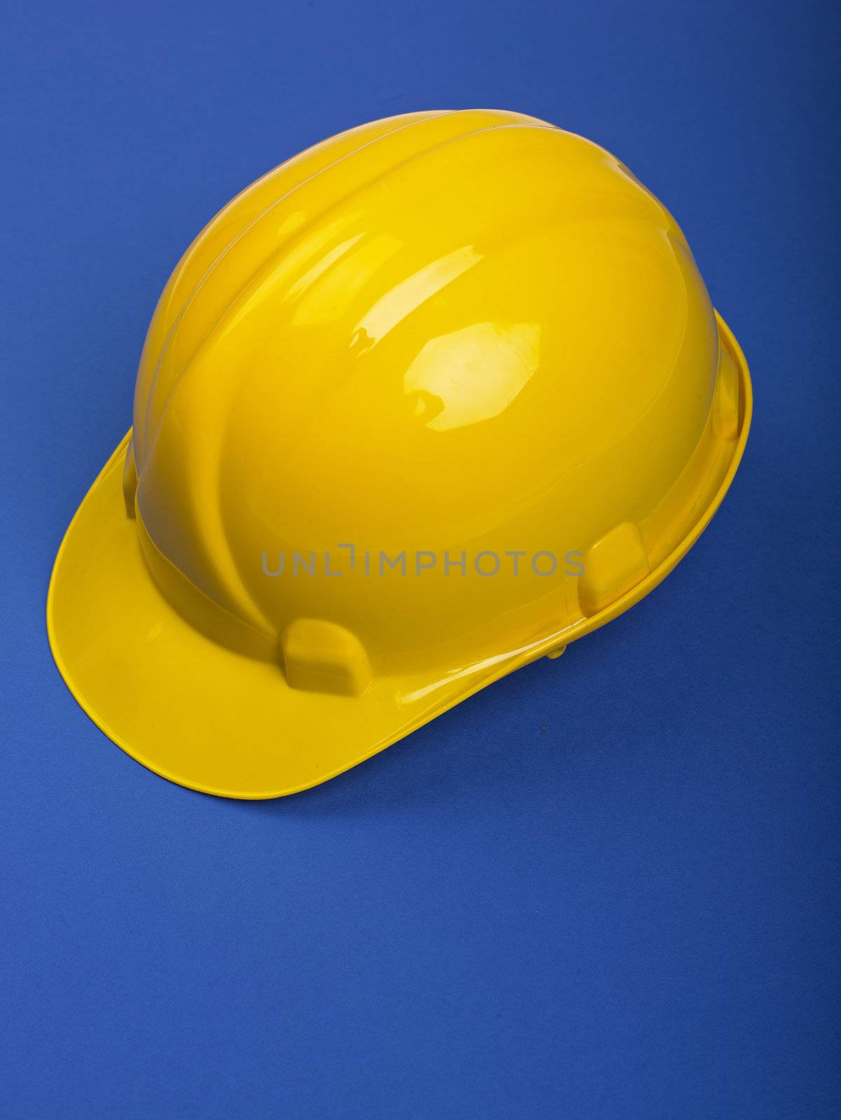 HYellow ardhat hard hat Helmet on Blue