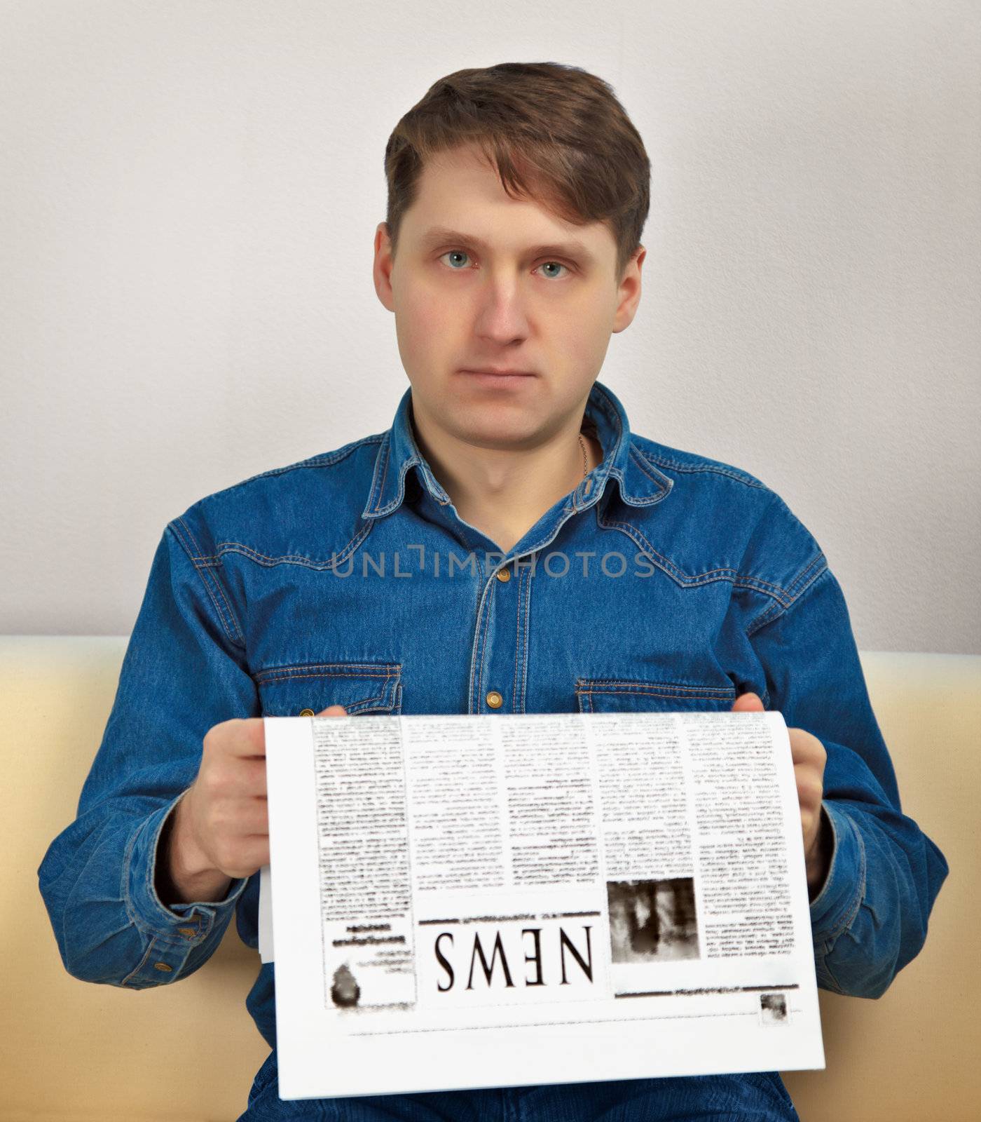 Man reads newspaper by pzaxe