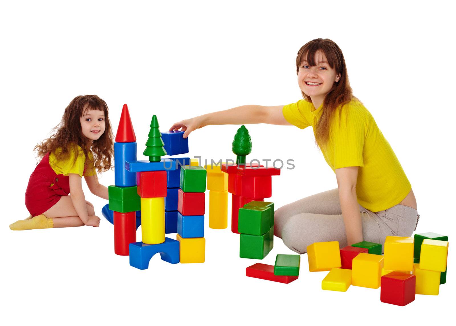 Happy mother and daughter playing with blocks isolated on white