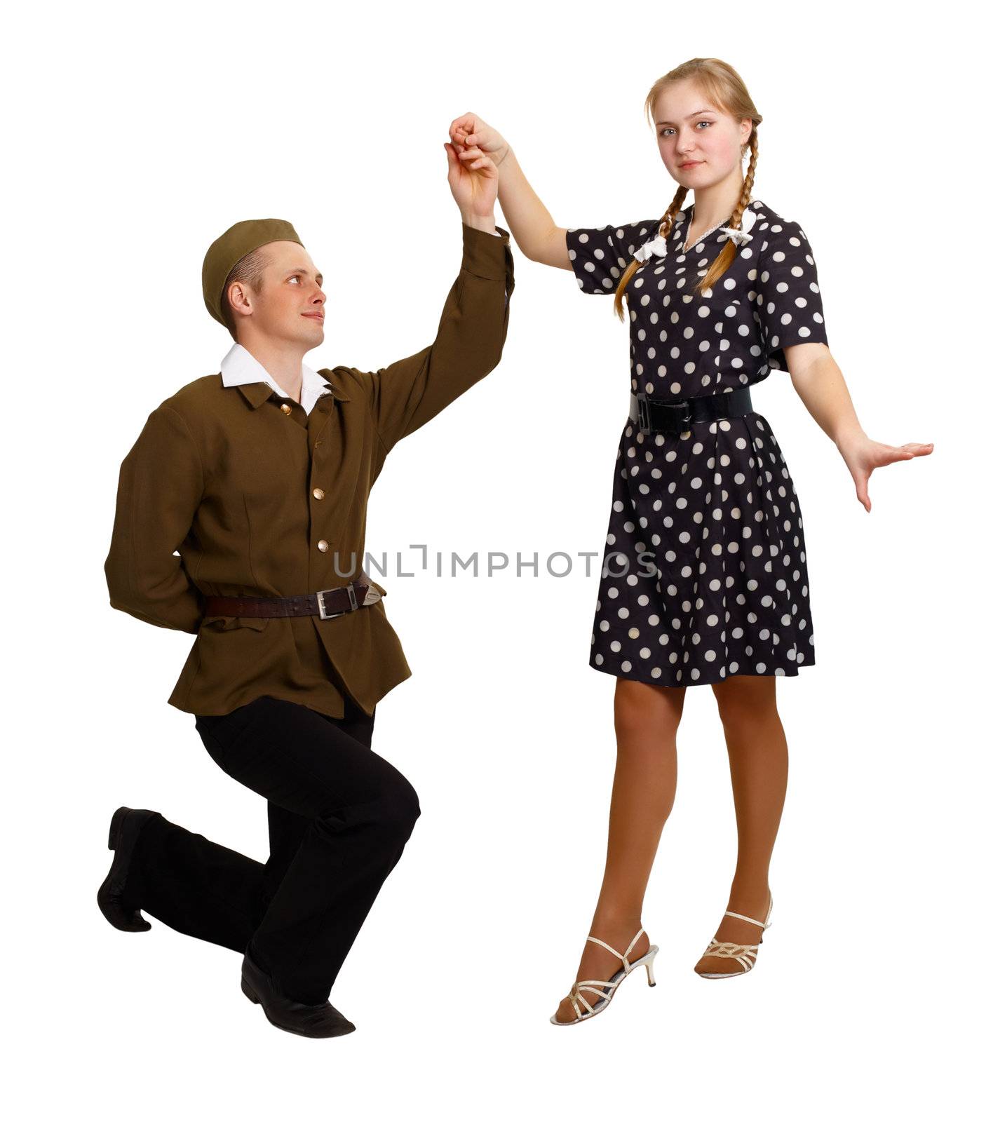 A pair of young people perform a dance in the costumes of the 60s isolated on white background