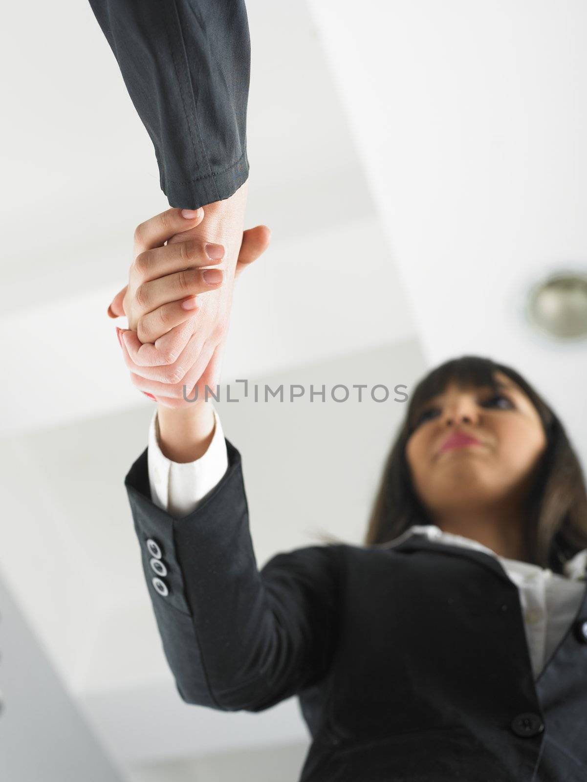 Handshaking in office low angle by adamr