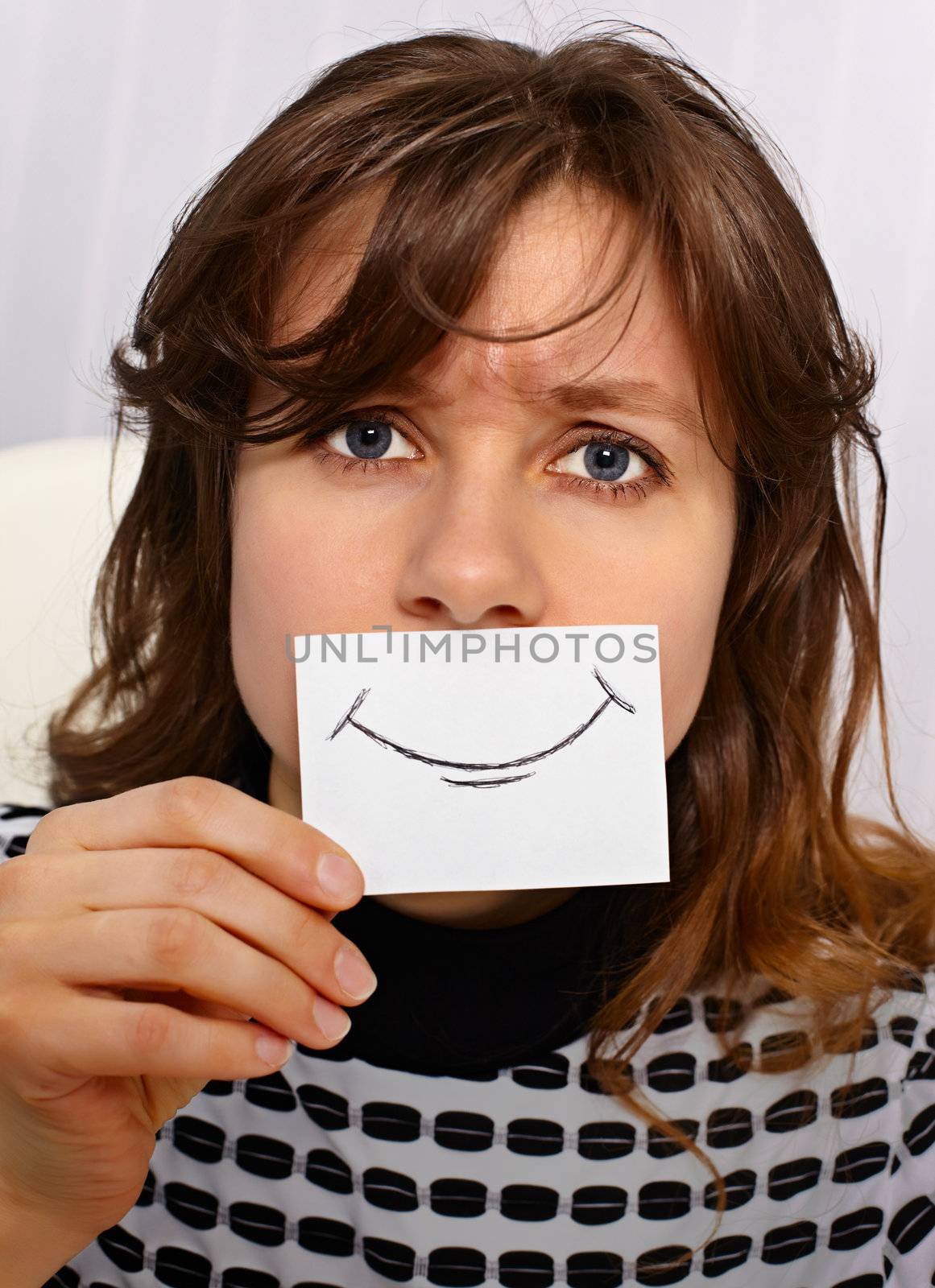 Tired woman smiles as may - portrait close up