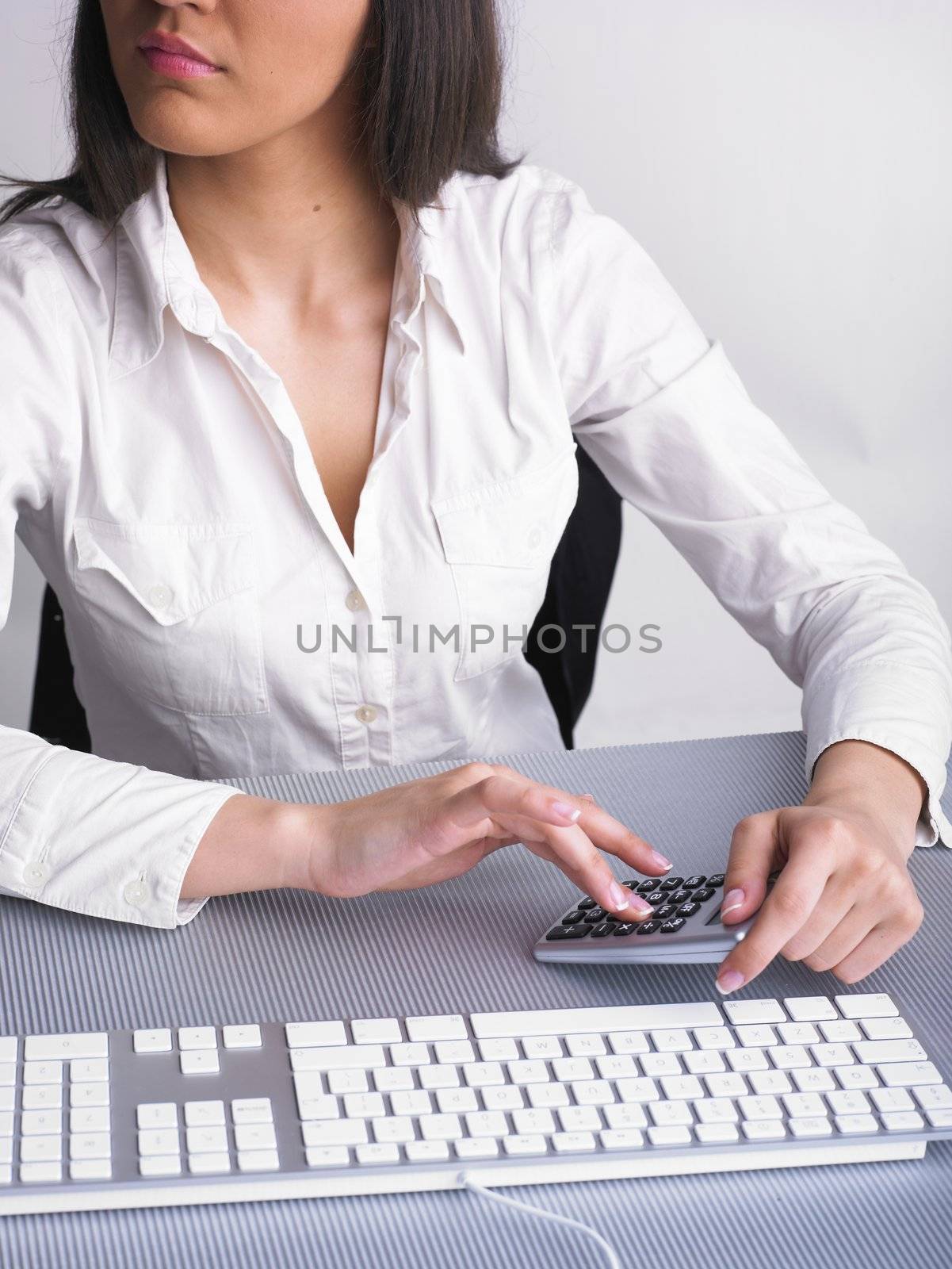 Businesswoman in Business suit Analyzing data and plan by adamr