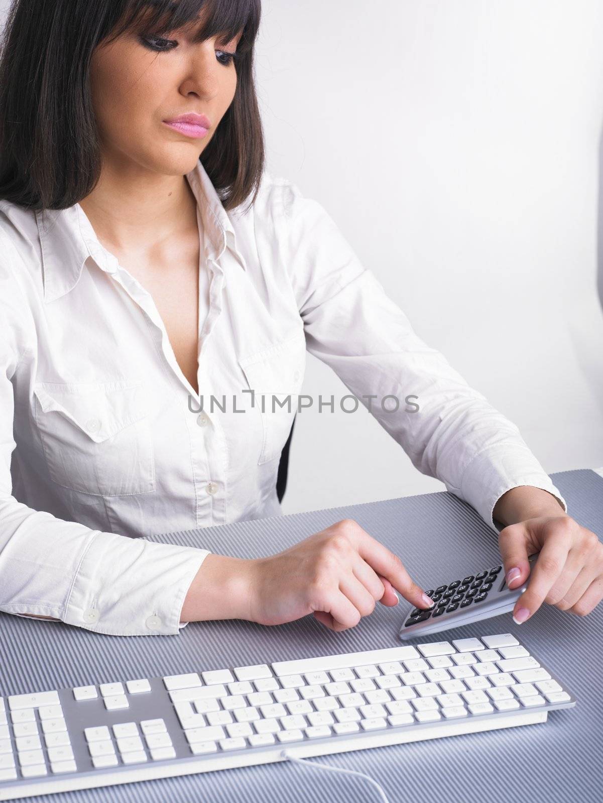 Businesswoman in Business suit Analyzing data and plan by adamr