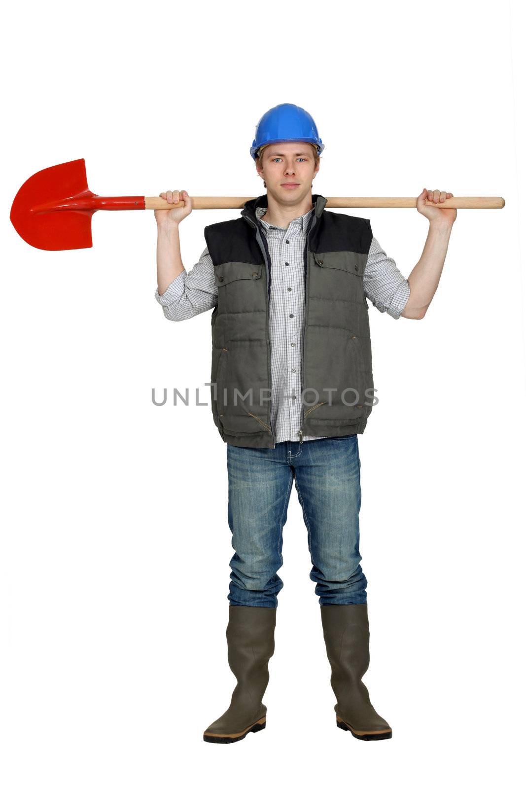 bricklayer holding shovel