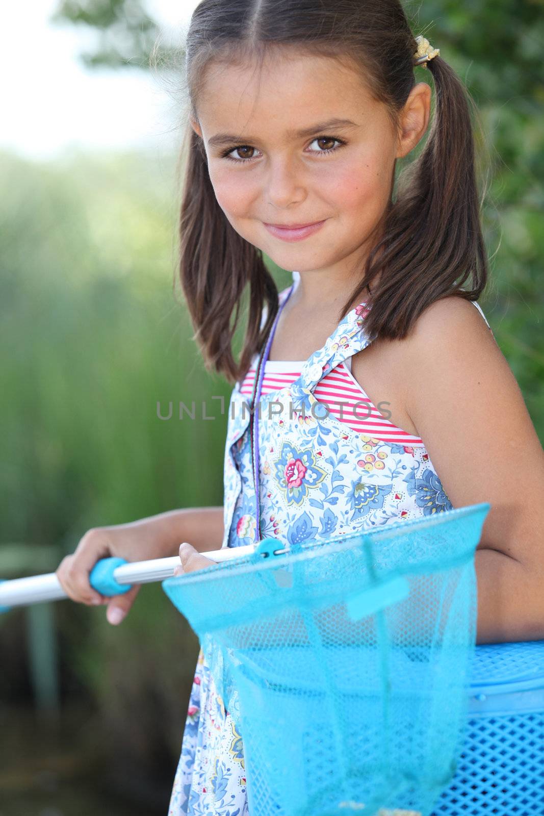 Young girl with a fishing net