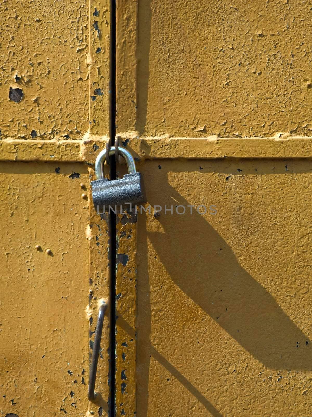 Iron access lock on brown antique door