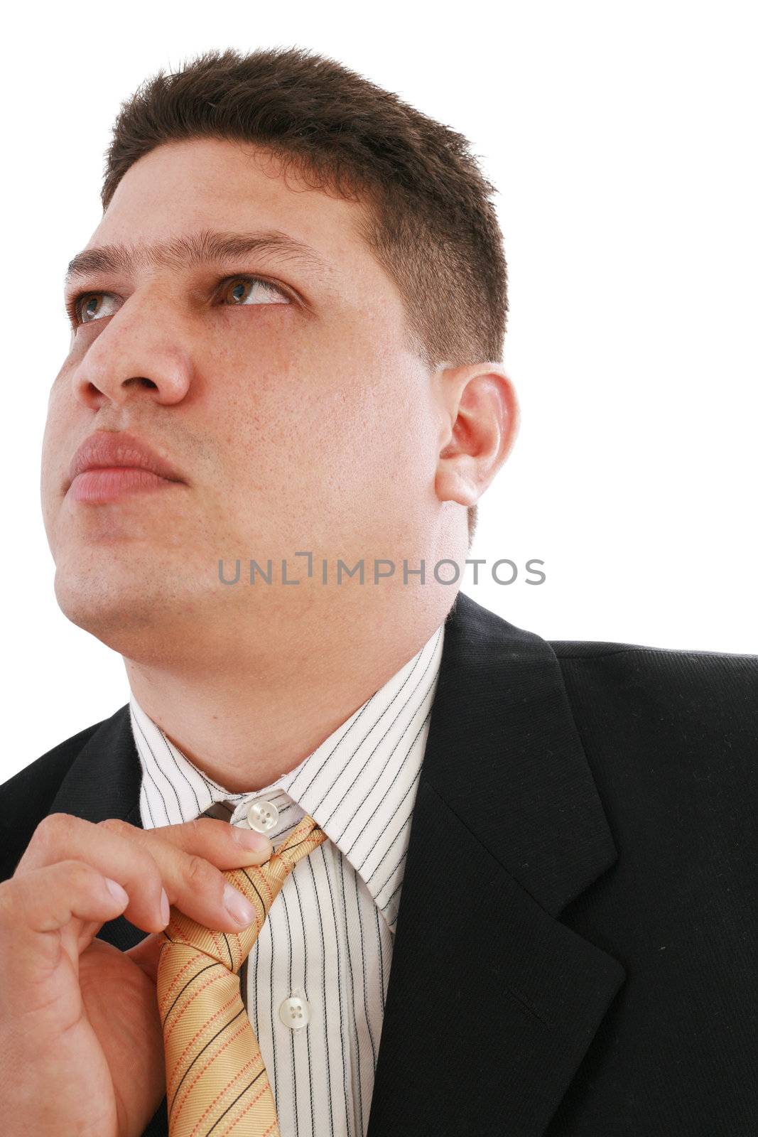 Business man fixing his tie, isolated over white