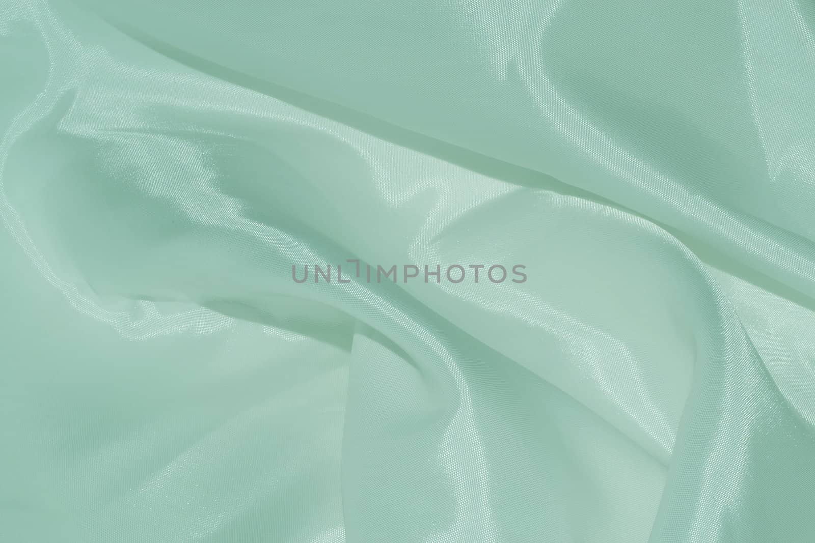 soft light green silk background.