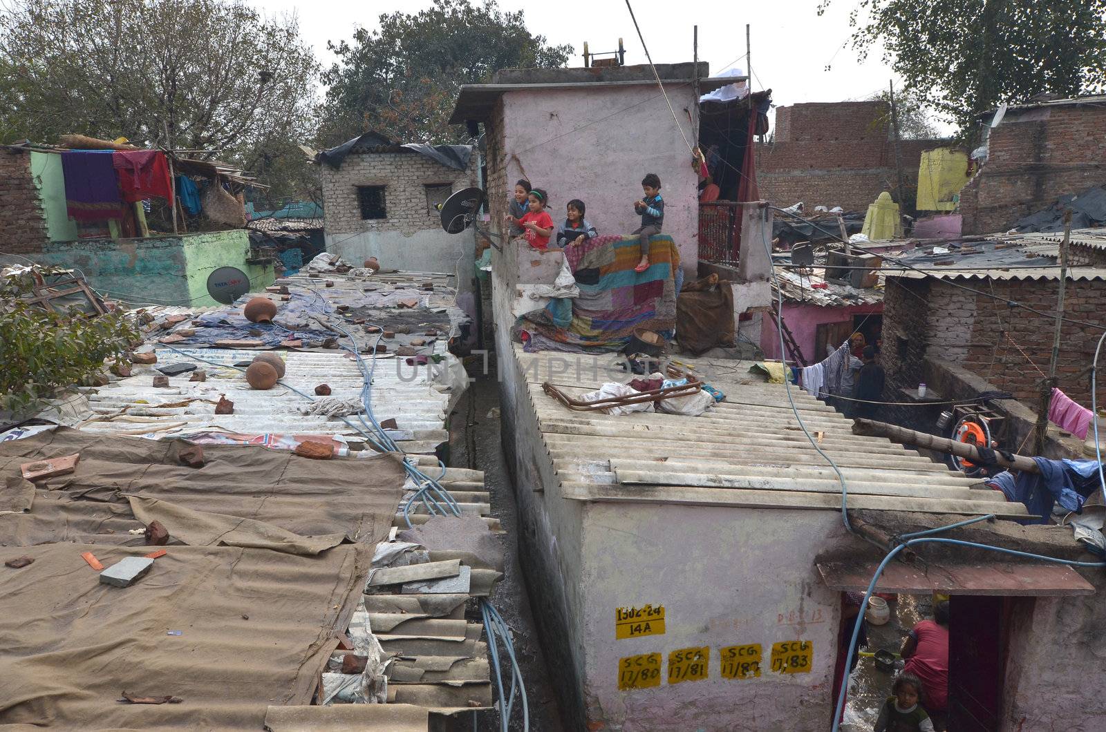 New Delhi,India-February 4, 2013:children not unidentified play on the rooftops of the largest slum in New Delhi.50% of the population of New Delhi is thought to live in slums,on February 4,2013 in New Delhi