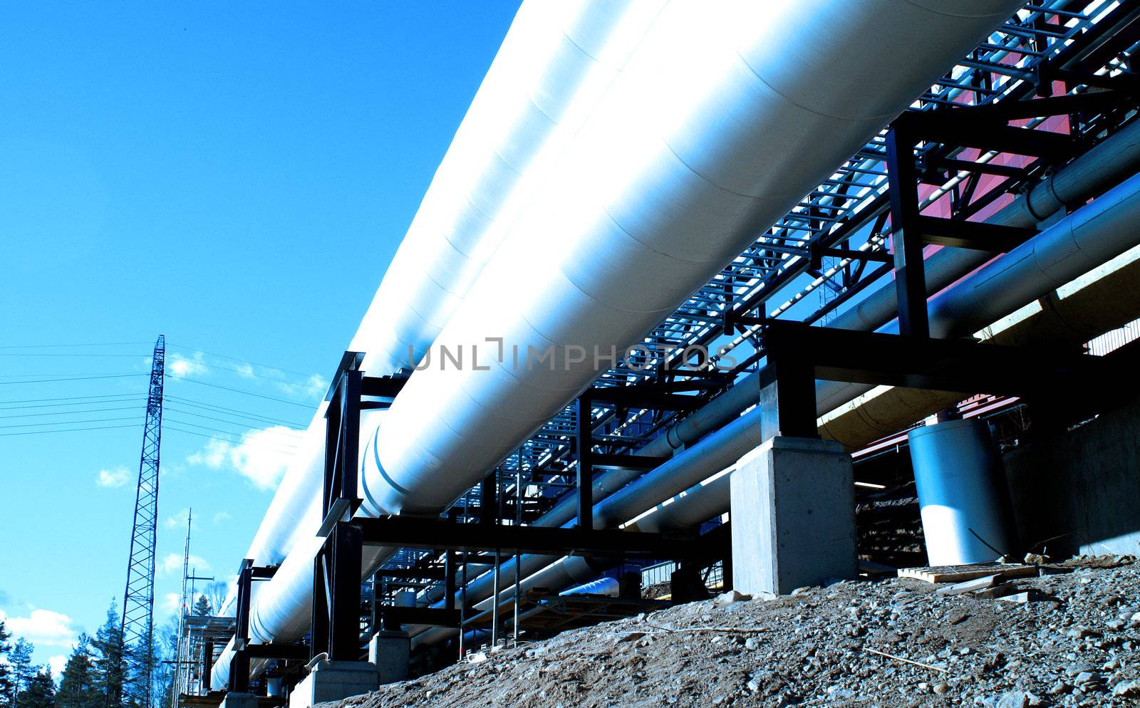 industrial pipelines with insulation against natural blue backgr by nostal6ie